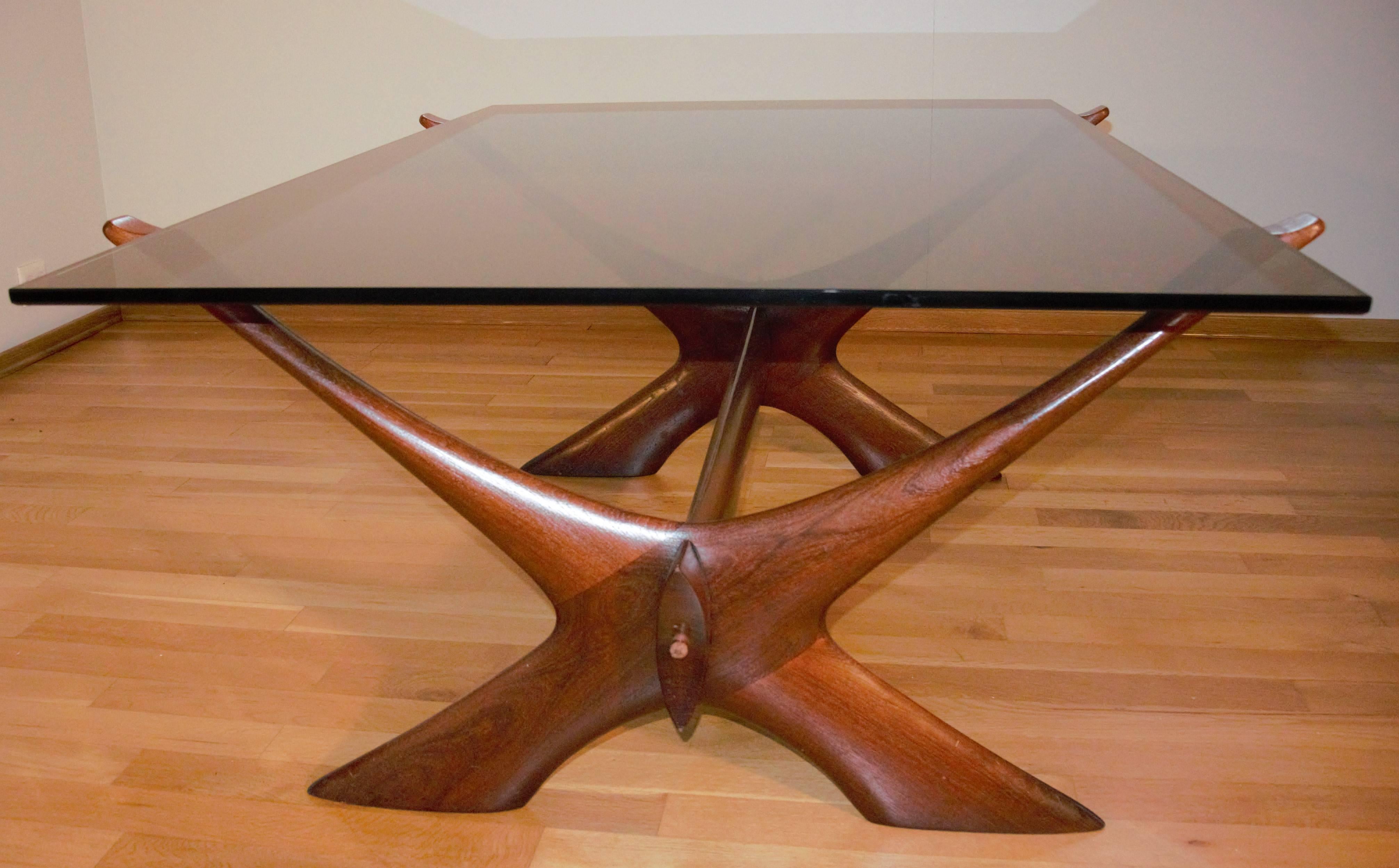 Beautiful and stylish sculptured teak base table will look fabulous in a lounge or office as a coffee table or side table.

Model Nr 9. 
Designed by Fredrik Schriever and called The Abeln, produced by Orebro, Sweden. Glasbord nr 9 ca 1967, Bangkok