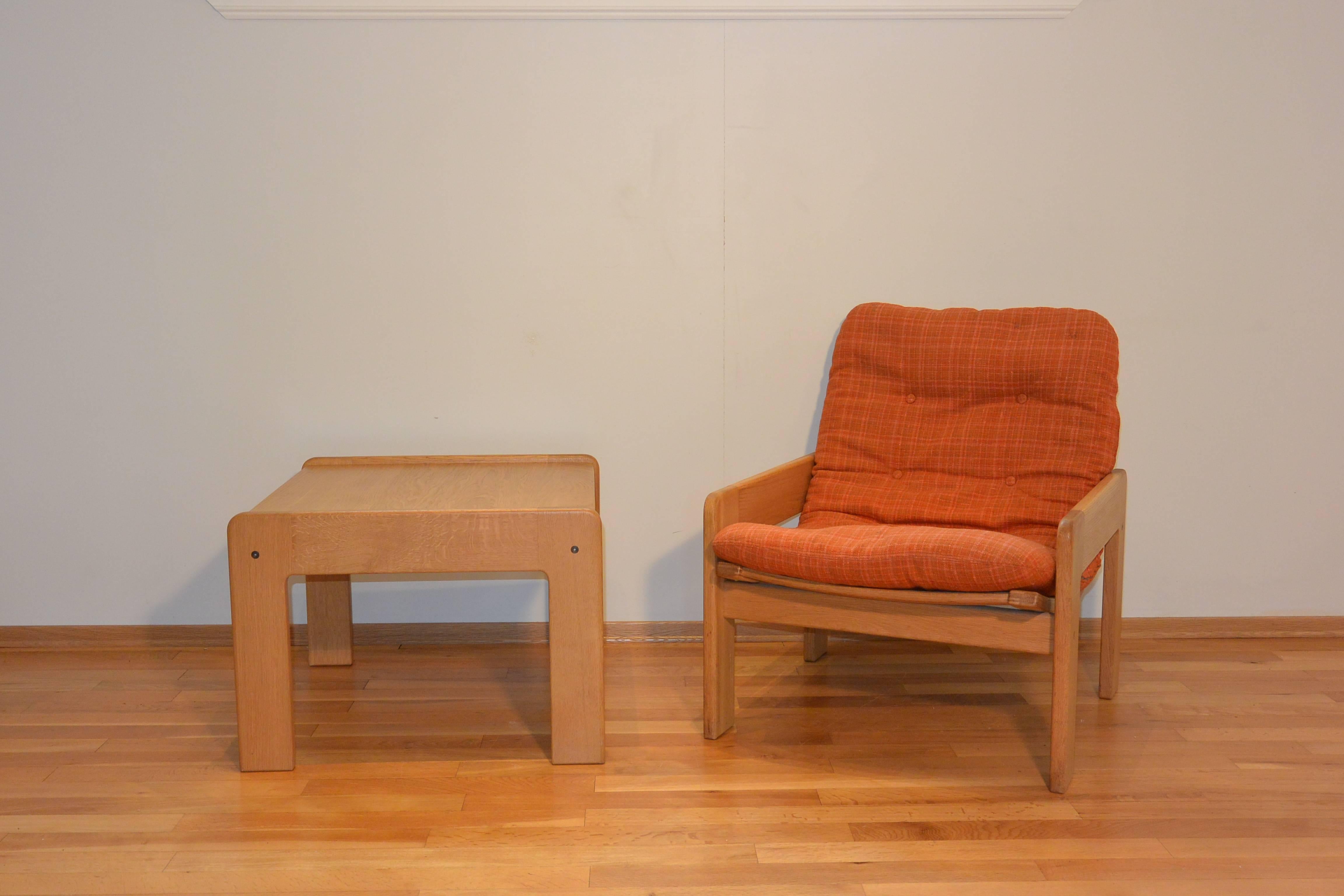 Light oak Swedish chair and table pair by designer Yngve Ekström for Swedese, early 1970s. The price offered is for the chair and table featured.

Modern geometric or cubic shape with bright orange and red upholstered cushion makes a bold statement.