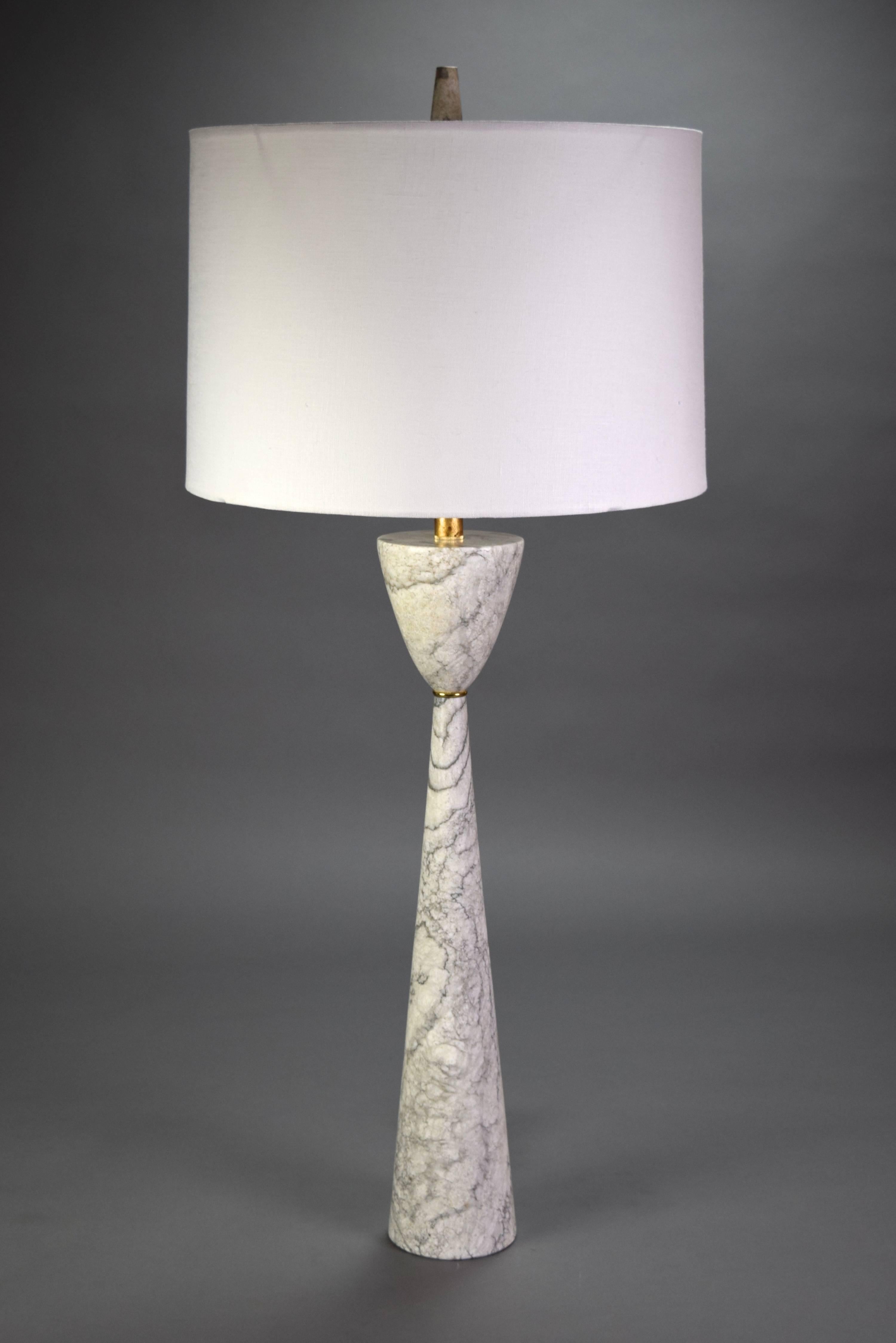 This Postmodern style lamp of white and gray variegated marble in the shape of a tall slender waisted cone.

Height to light fitting: 29
