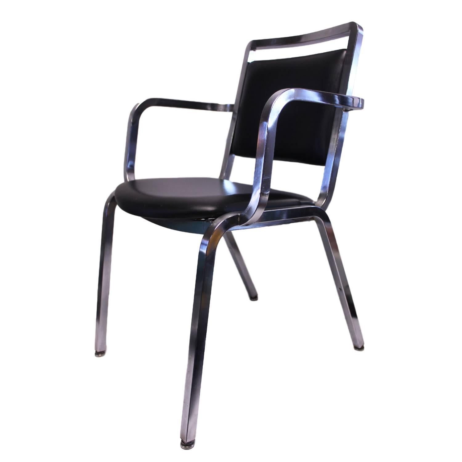 This fantastic set of chairs features beautiful Mid-Century design that seems like a blend of Sottsass's Nine-0 and the 1006 Navy chair. This set is also unusual as it features a welded steel frame with brushed chrome finish as opposed to the