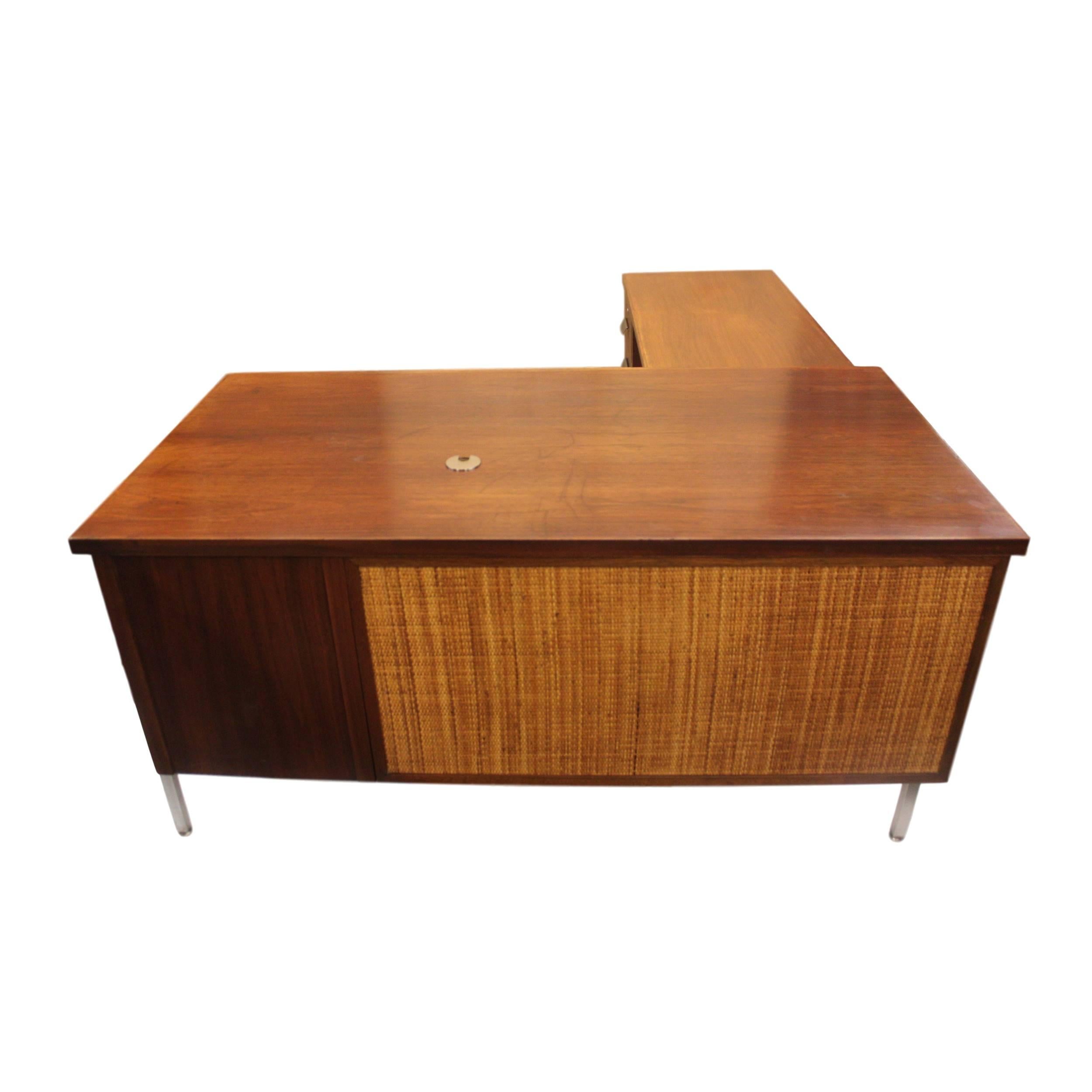 This desk is fresh from refurbishment and is in excellent overall condition. Walnut, chrome and cane combine with the gorgeous architectural lines to make this desk a real stand-out!

Desk features:

Walnut primary wood
Oak secondary