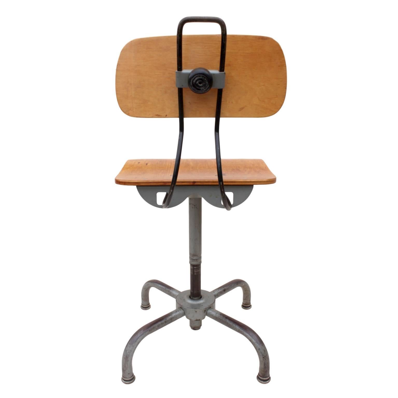 This great little stool spent the past 50 years of its life in a university laboratory and as a result, has a beautifully worn patina to the gray frame and base. Bentwood seat and back have been given a new coat of stain and finish and are in very