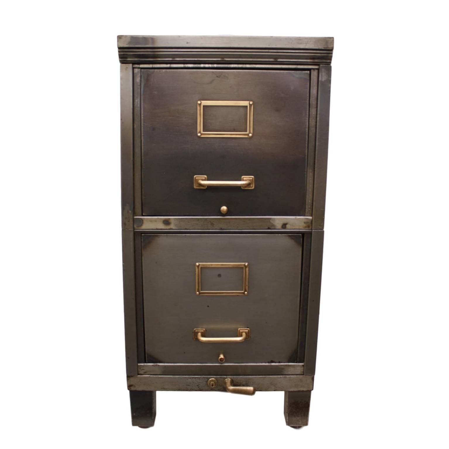 This wonderful little file cabinet has been customized in our workshop with a hand-stripped, hand-polished, raw steel patina sealed with a semi-gloss lacquer finish. The polished gray metal is beautifully complimented by the hand-polished original