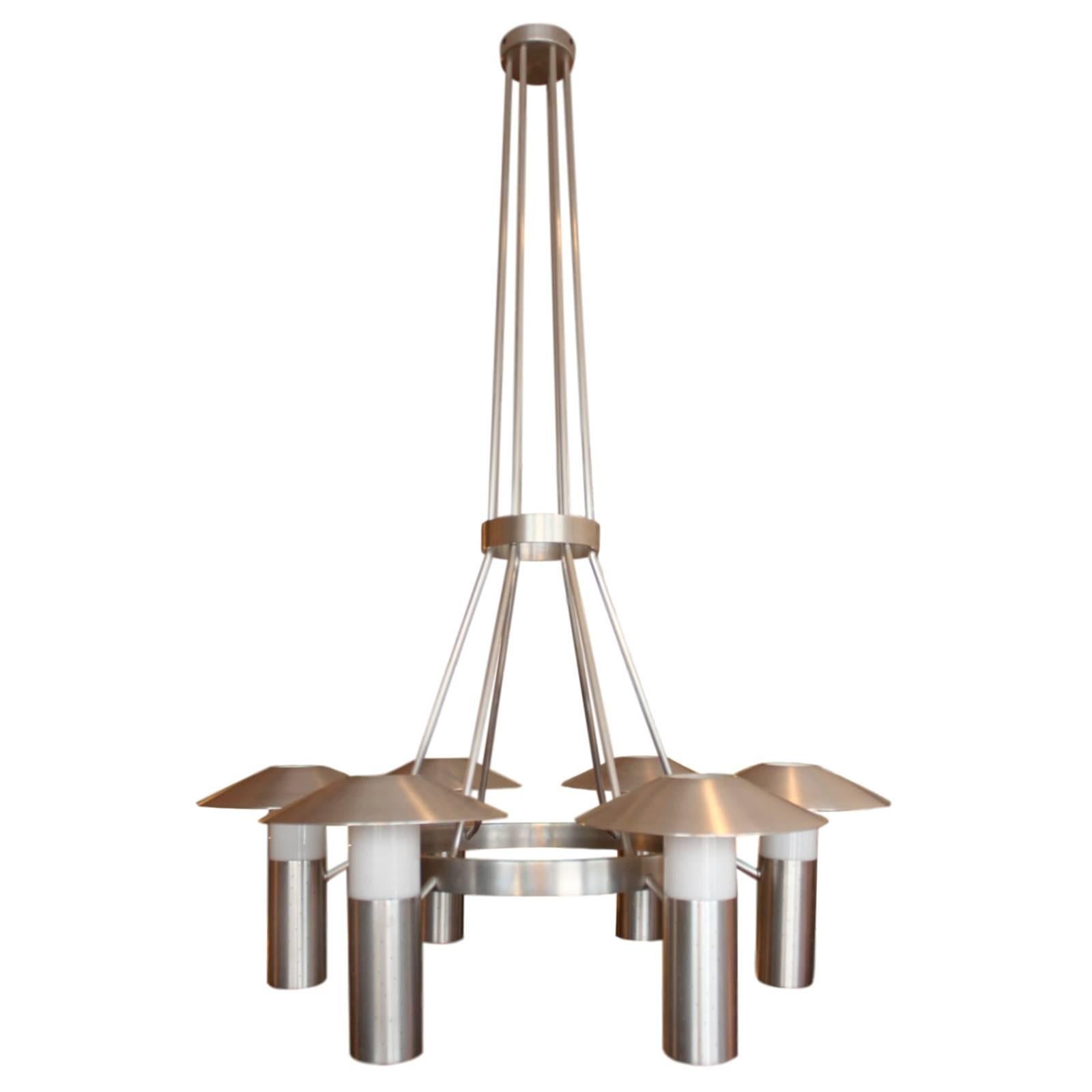 Do you have a massive, poorly lit Mid-Century Modern mansion that's missing a certain je ne sais quoi? Well look no further than this sensational, custom-made 1950s chandelier! Chandelier is completely constructed from solid brushed aluminum with