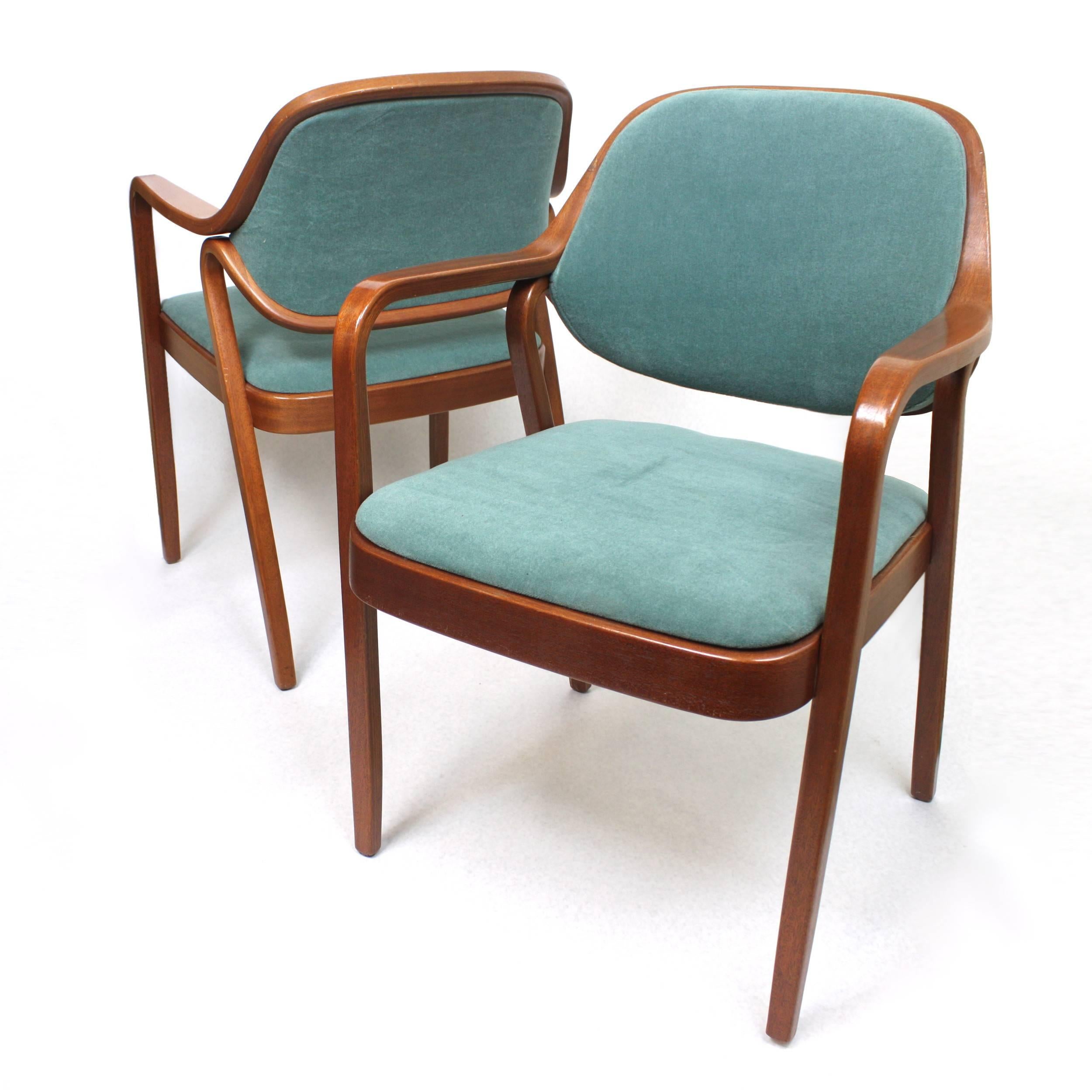 This curvaceous pair of bent-mahogany armchairs were designed by Don Pettit and manufactured by Knoll. Chairs feature new teal velour upholstery that compliments the red mahogany frames beautifully and really makes these babies pop! Their versatile