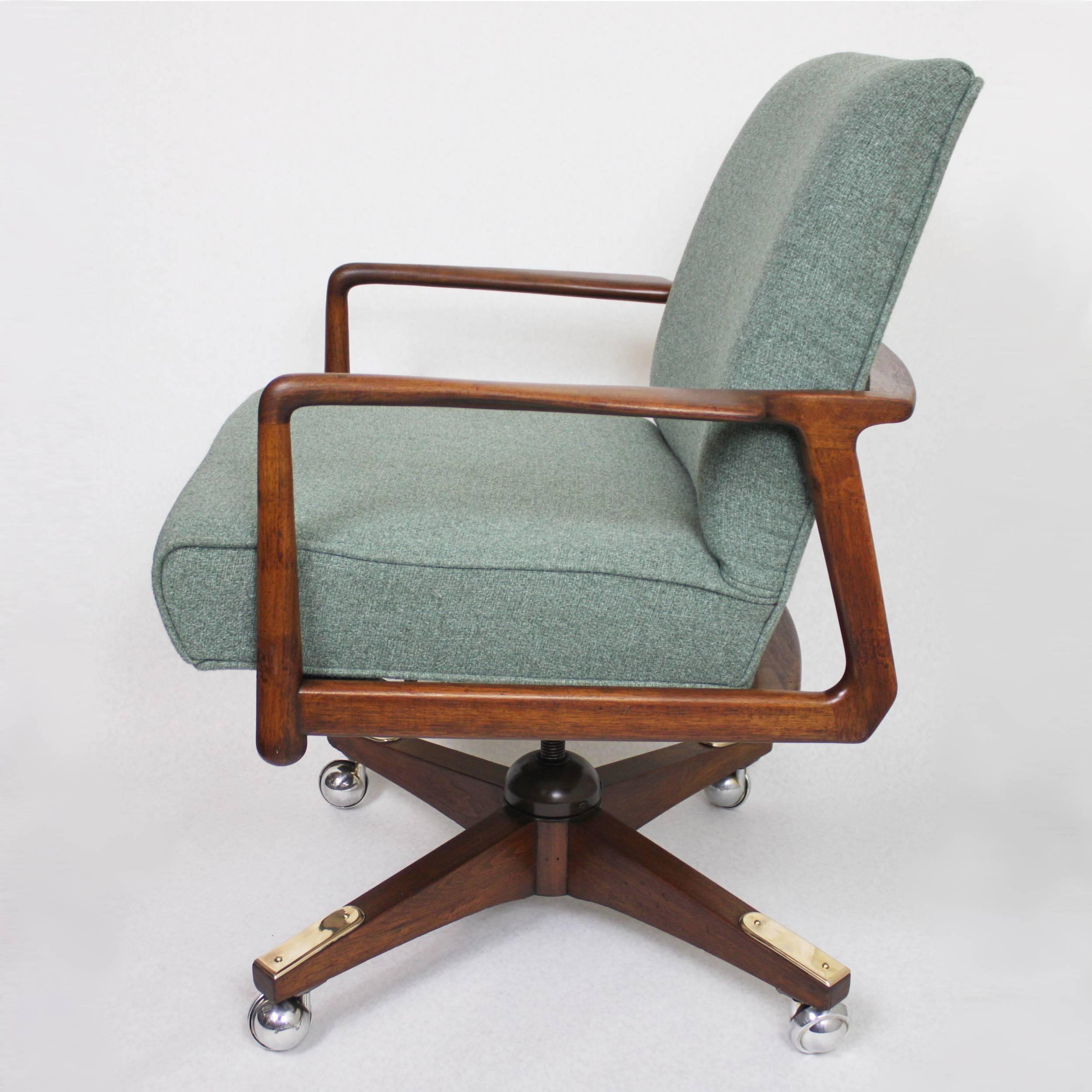 This spectacular desk chair is an original 1950's design by George Reinoehl for Stow Davis.  Chair features a wonderful sculpted walnut frame, adjustable height, and a rolling swivel base.  Chair is fresh off a complete restoration with a fully