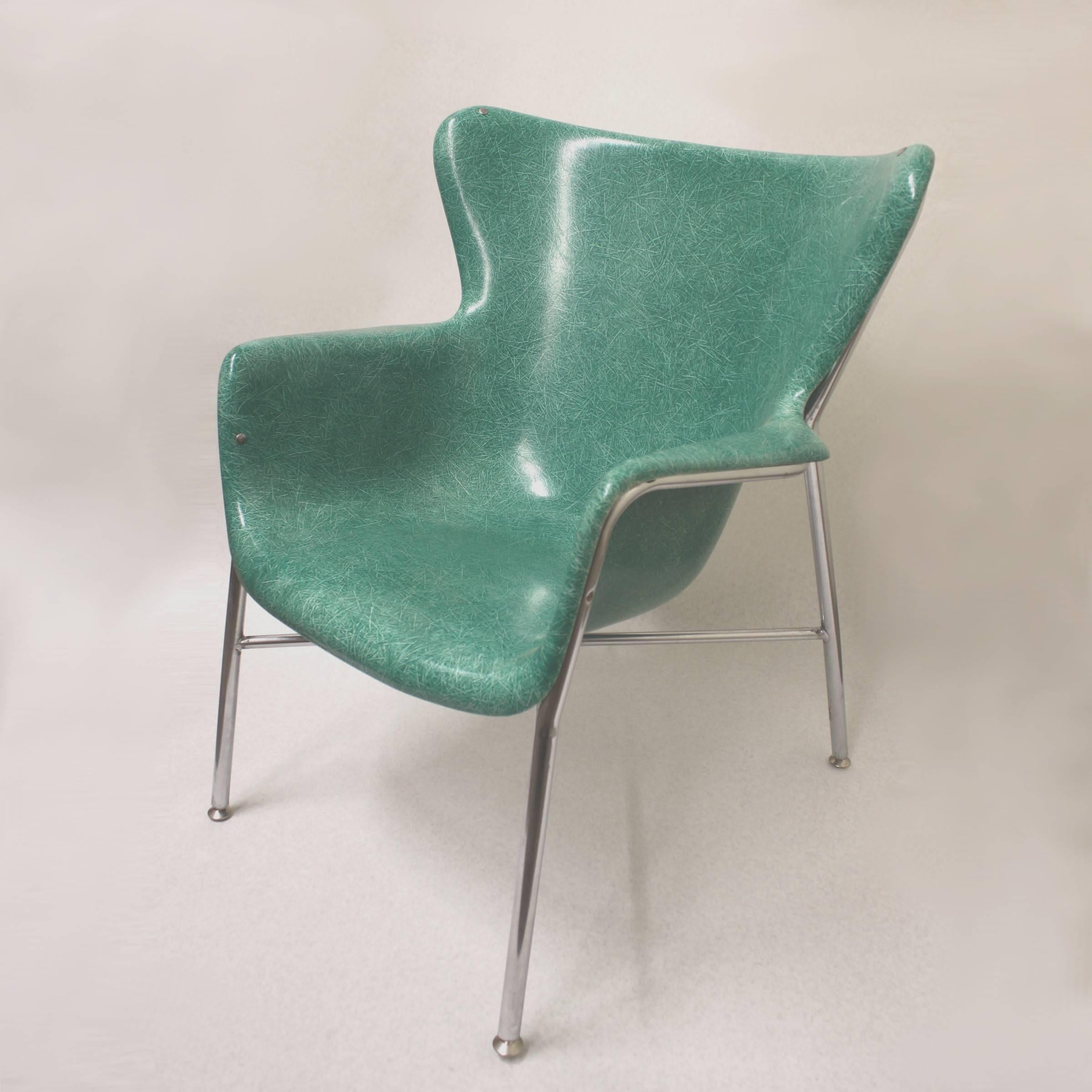 This fantastic chair is a 1973 vintage piece originally designed by either Lawrence Peabody or Luther Conover. Chair features a green fiberglass shell in a unique 