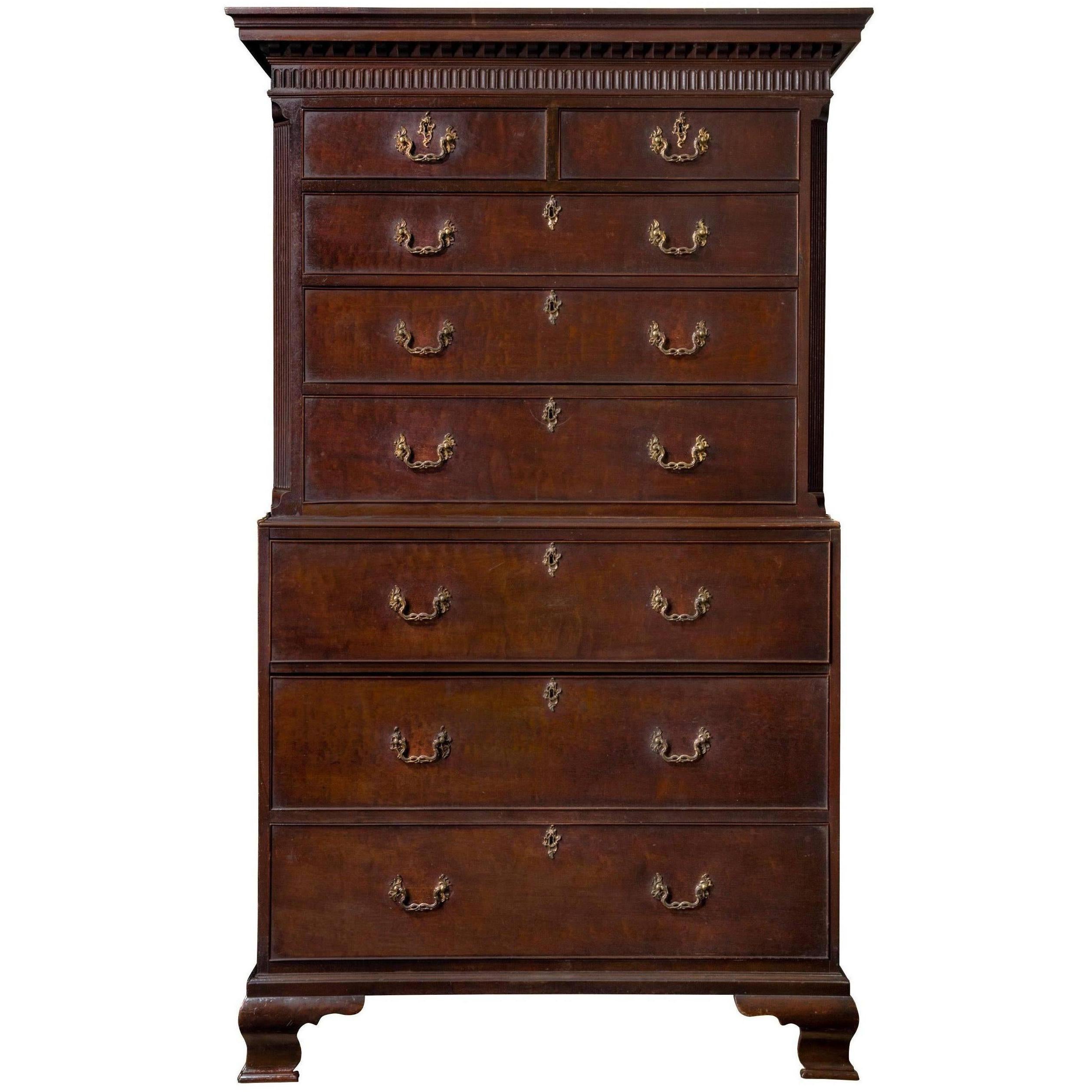 An important George II period mahogany secretaire chest on chest. The architectural form of the cornice and entablature are pure Palladian and are exquisitely executed. The top section of graduated drawers is framed by canted and fluted corners,