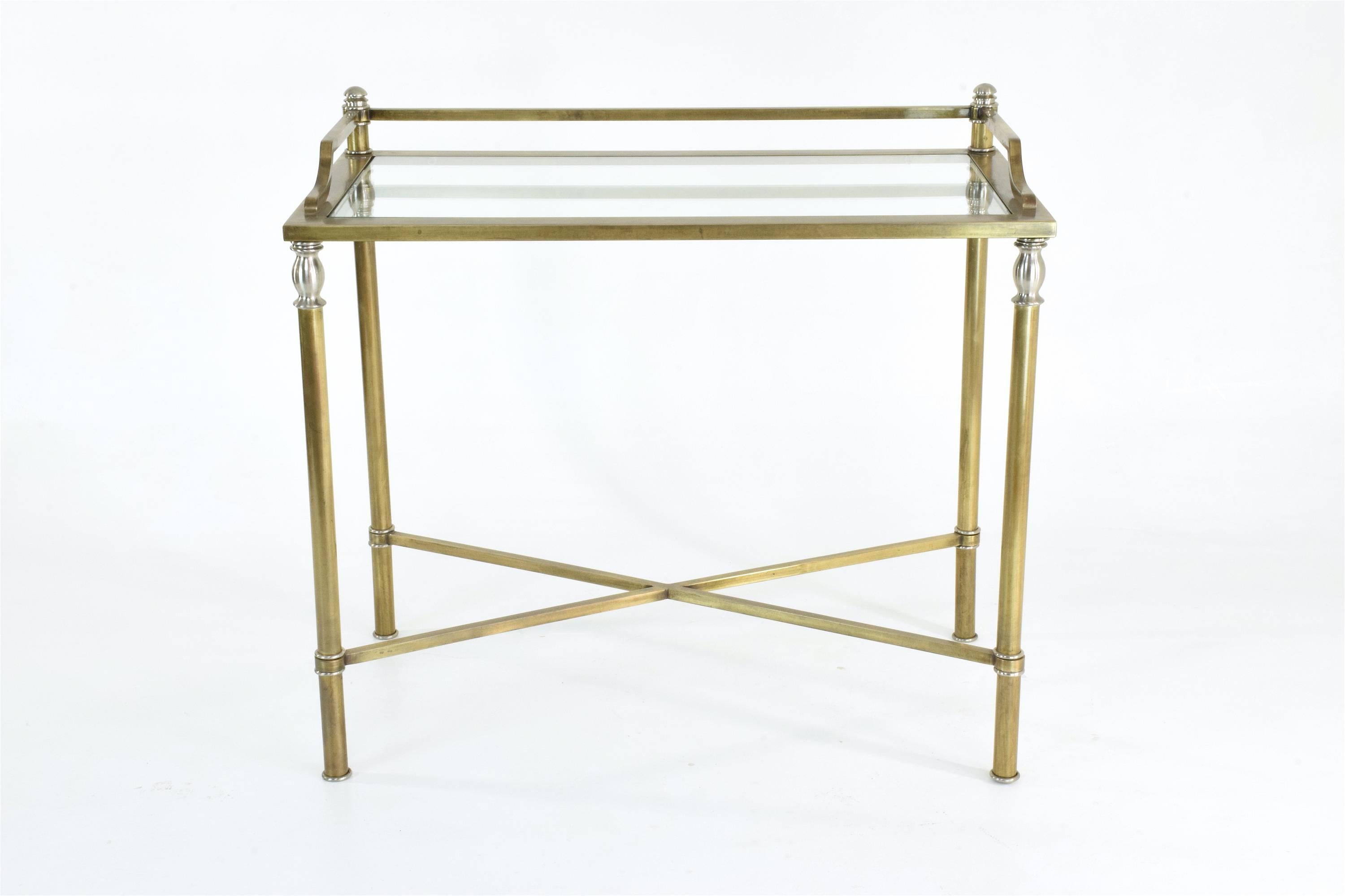 Modern neoclassical style Mid-Century desk composed out of glass and polished brass with beautiful chrome details and cross shaped base, 
France, circa 1970s. 
Could be used as an original console or vanity table. 

The items is presented with