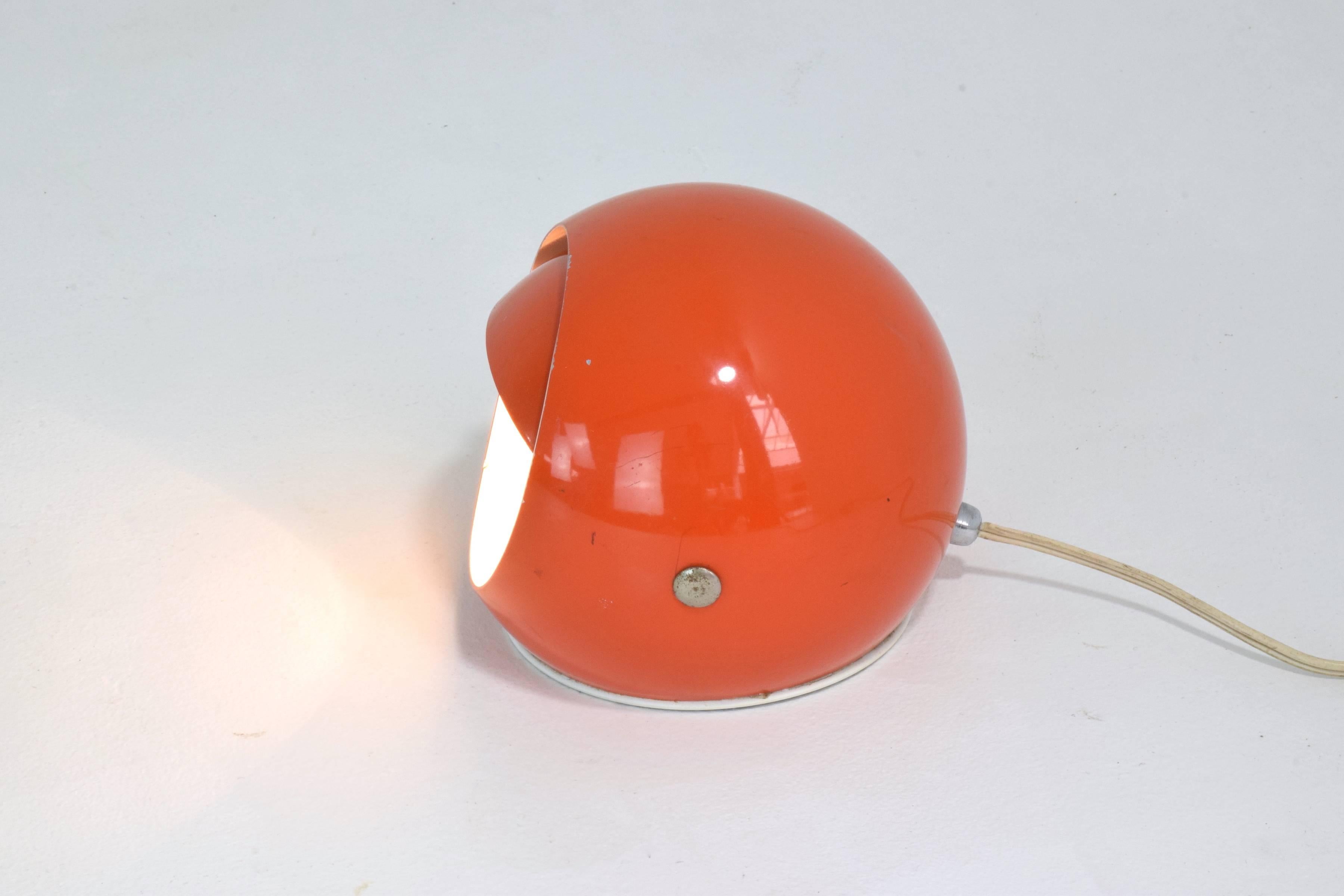 Mid-Century spherical Stilux Milano table or desk lamp with an adjustable shade in its original vintage orange lacquered steel design. 

Labelled,
Italy, circa 1960s.