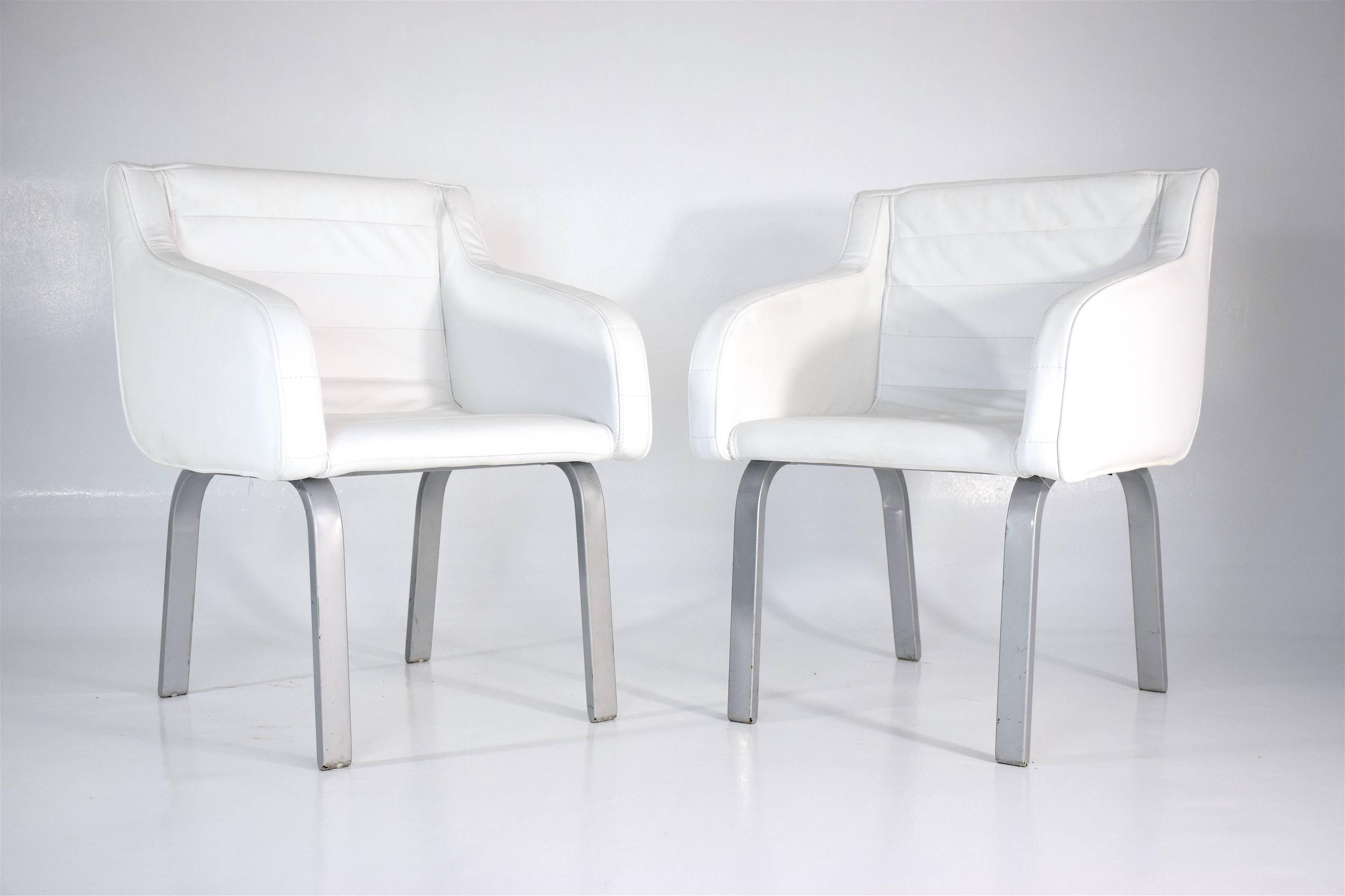 20th-century vintage pair of armchairs designed by French architect Christian Biecher for an elite Parisian restaurant named le Korova in 1999. These were edited by Italian notable furniture maker Poltrona Frau.

These chairs have recently been