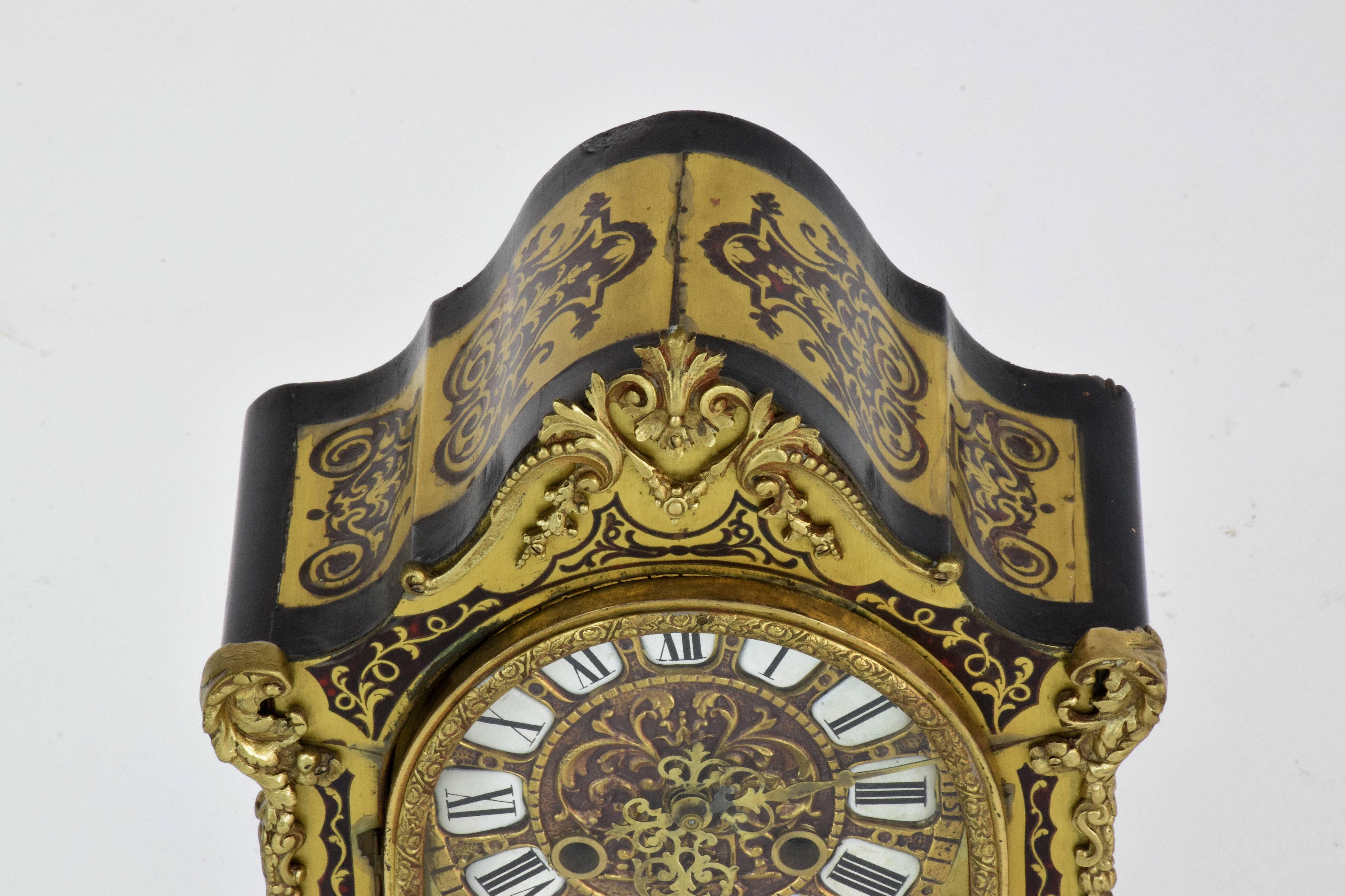 
An early 1900 French bell striking clock crafted in 18th century style (popular clockmaker design before the revolution cut off the heads of most customers for expensive clocks).

These types of clocks were made by sandwiching plates of brass and