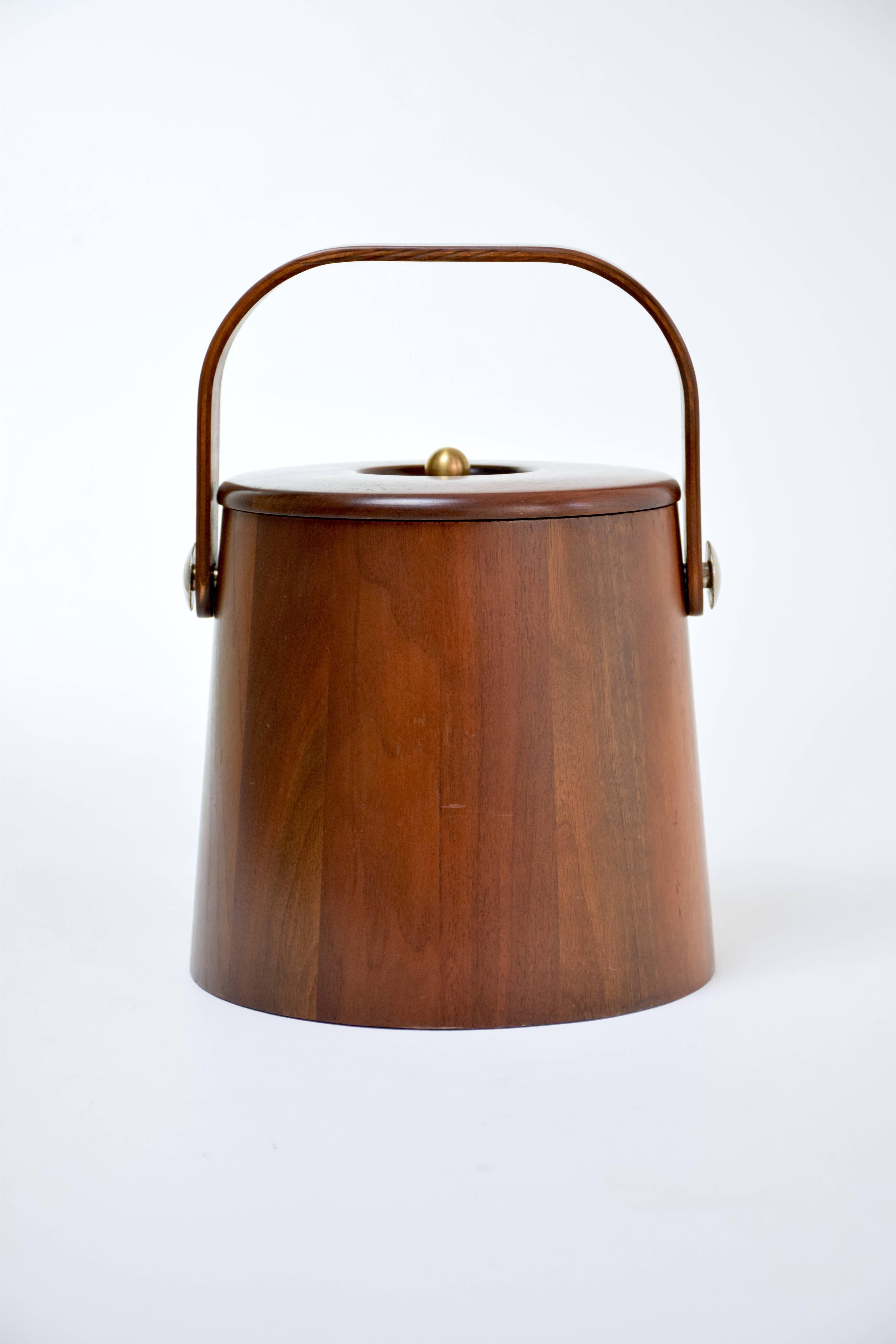 Vintage Danish midcentury ice bucket originating from Denmark in Scandinavian Modern style with brass handle at the top. 
In very good condition.
Circa 1950-1950's. 