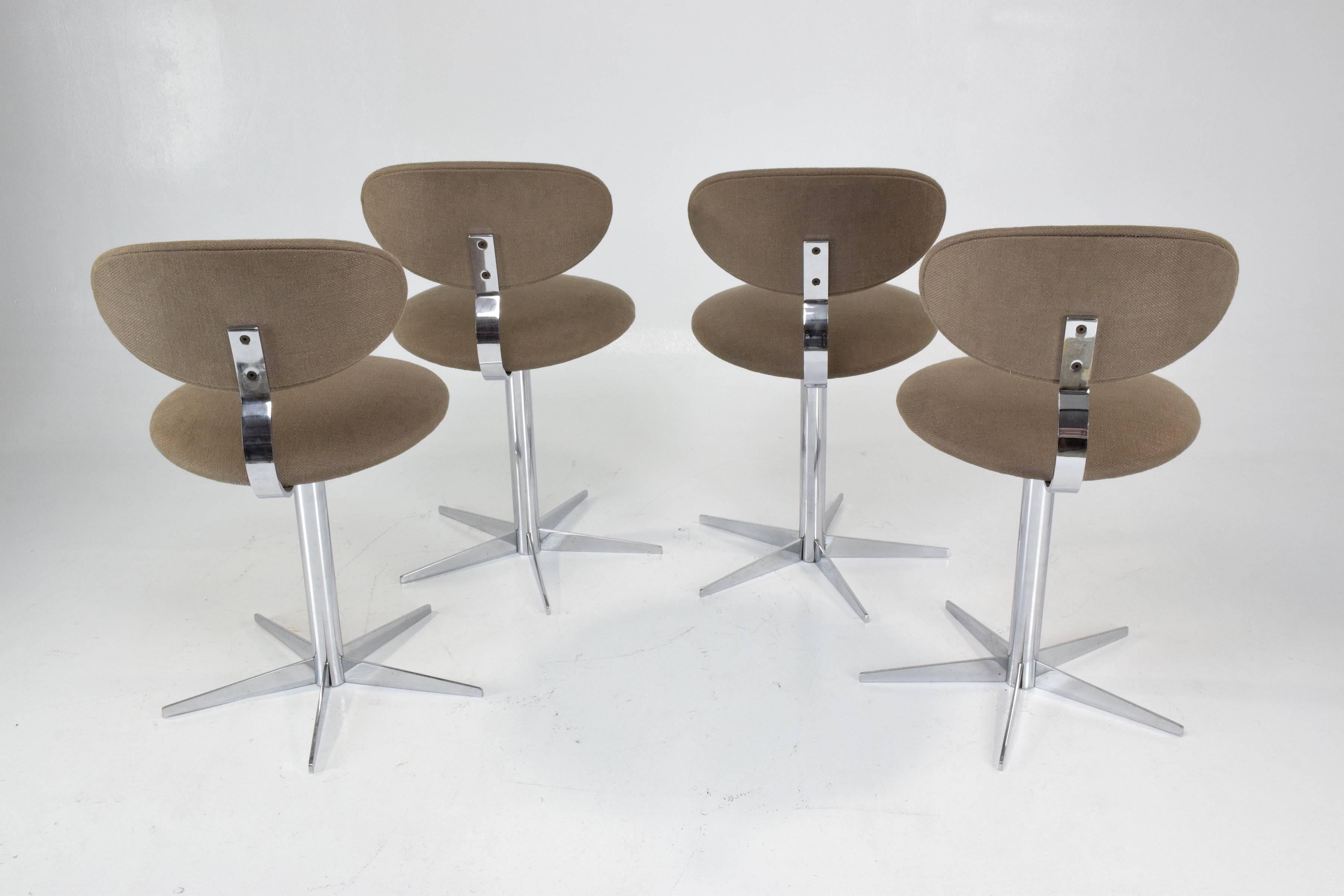 Set of four 20th century vintage swivel dining or side chairs designed with a curved chromed solid steel structure and fully restored in Lelièvre Paris light brown upholstery.

France, circa 1970s.
 ----
All our pieces are fully restored at our