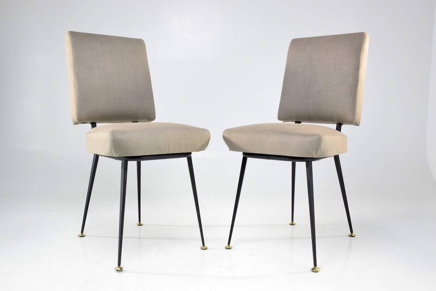 20th century vintage set of two of restored French chairs composed of a black lacquered steel structure, beautiful polished brass endings and re-upholstered with new padding in a velvet grey sand colour fabric.

We have left the steel structure in