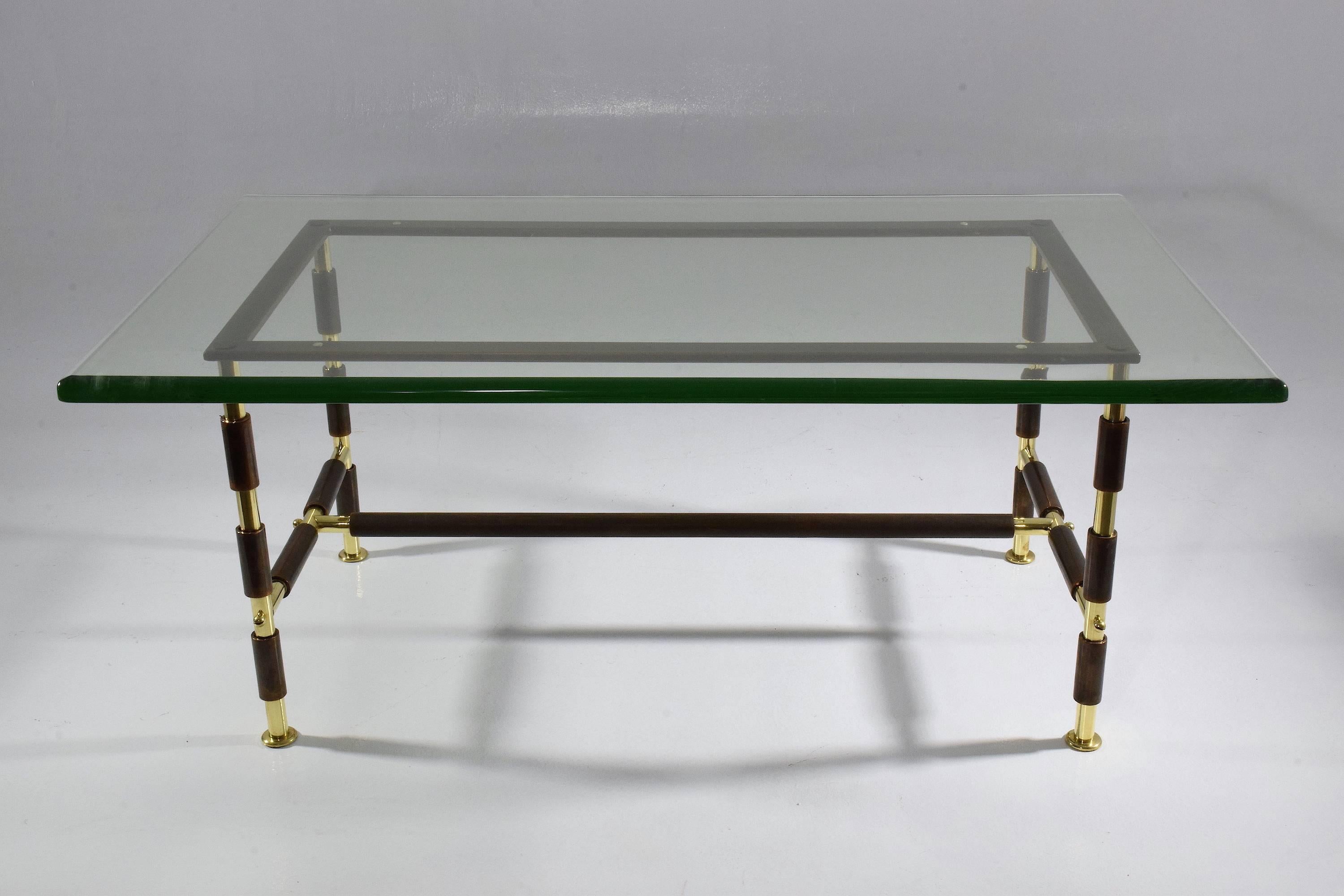 20th-century vintage Italian collectible coffee or cocktail center table no. 1736 designed by Max Ingrand for Fontana Arte composed of polished brass and aged steel structure and available with its beautiful original thick and rounded clear glass