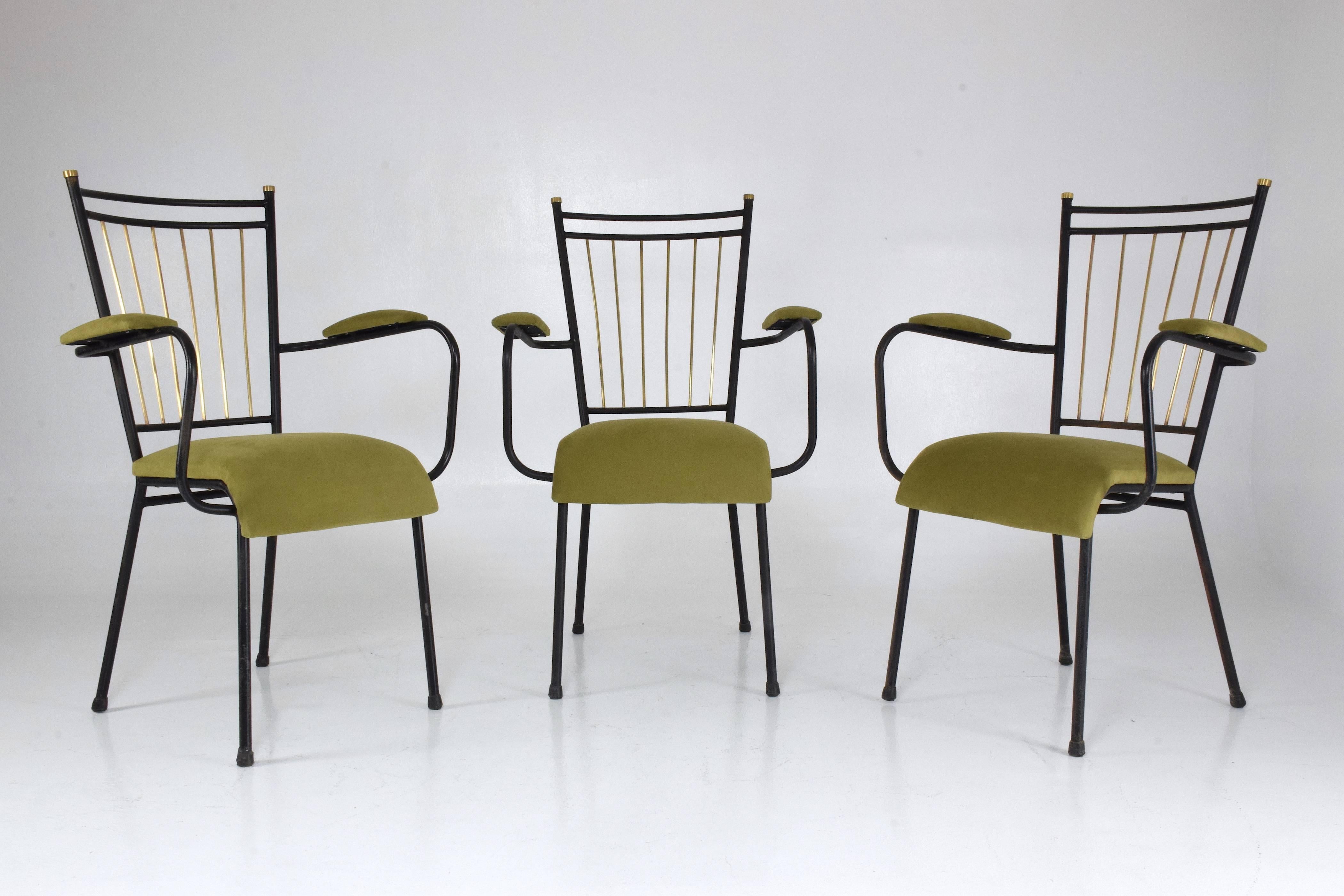 Three 20th century vintage Art Deco style side statement chairs in restored condition: polished brass details and reupholstered with new padding in a high-quality green Lelièvre Paris cotton fabric. These chairs are designed with a black lacquered