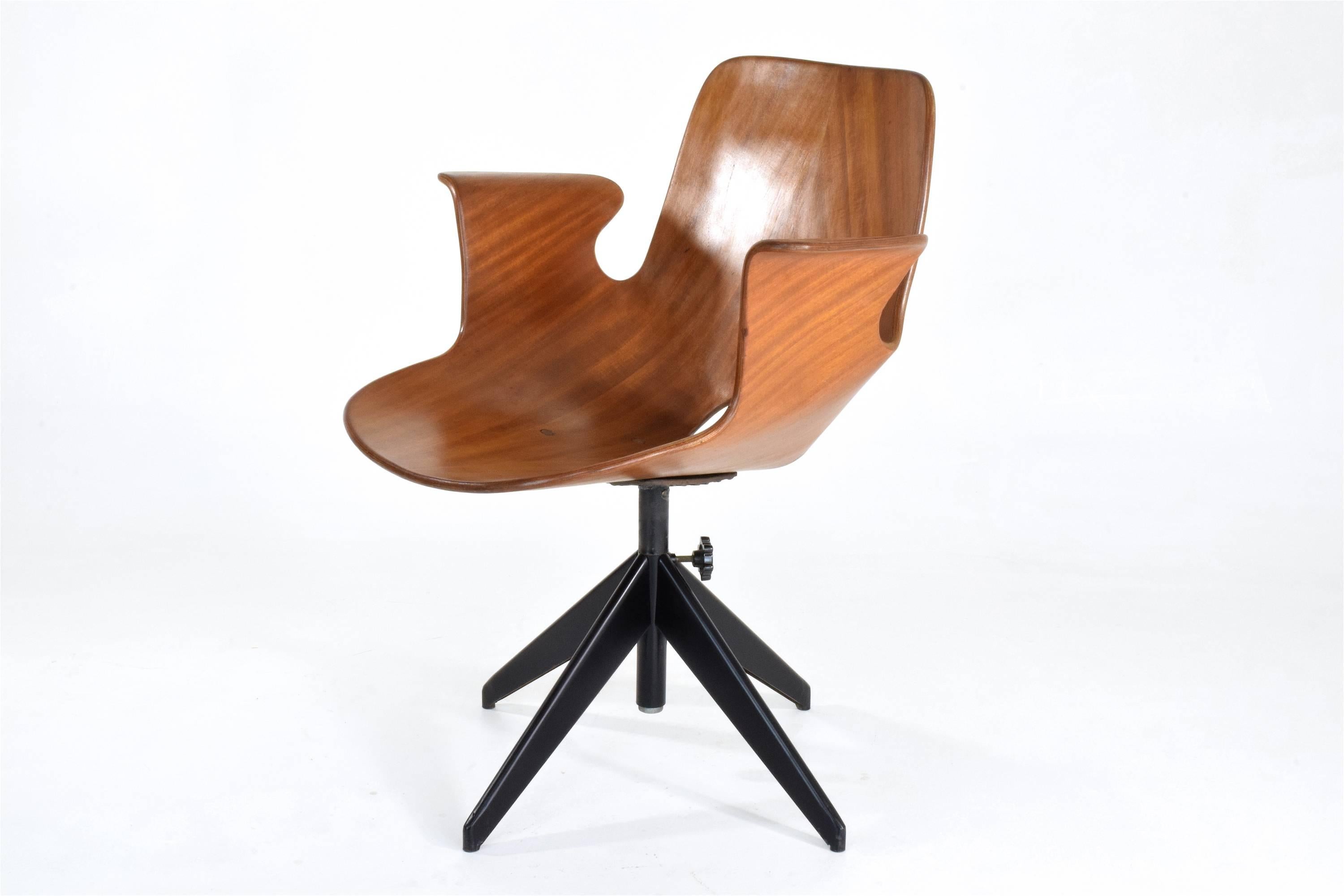 20th century vintage iconic Italian Medea office or desk armchair with rare swivel base, armrests designed by Vittorio Nobili for Fratelli Tagliabue manufactured in Italy, circa 1950s. This model is designed in a curved plywood seat and solid cast