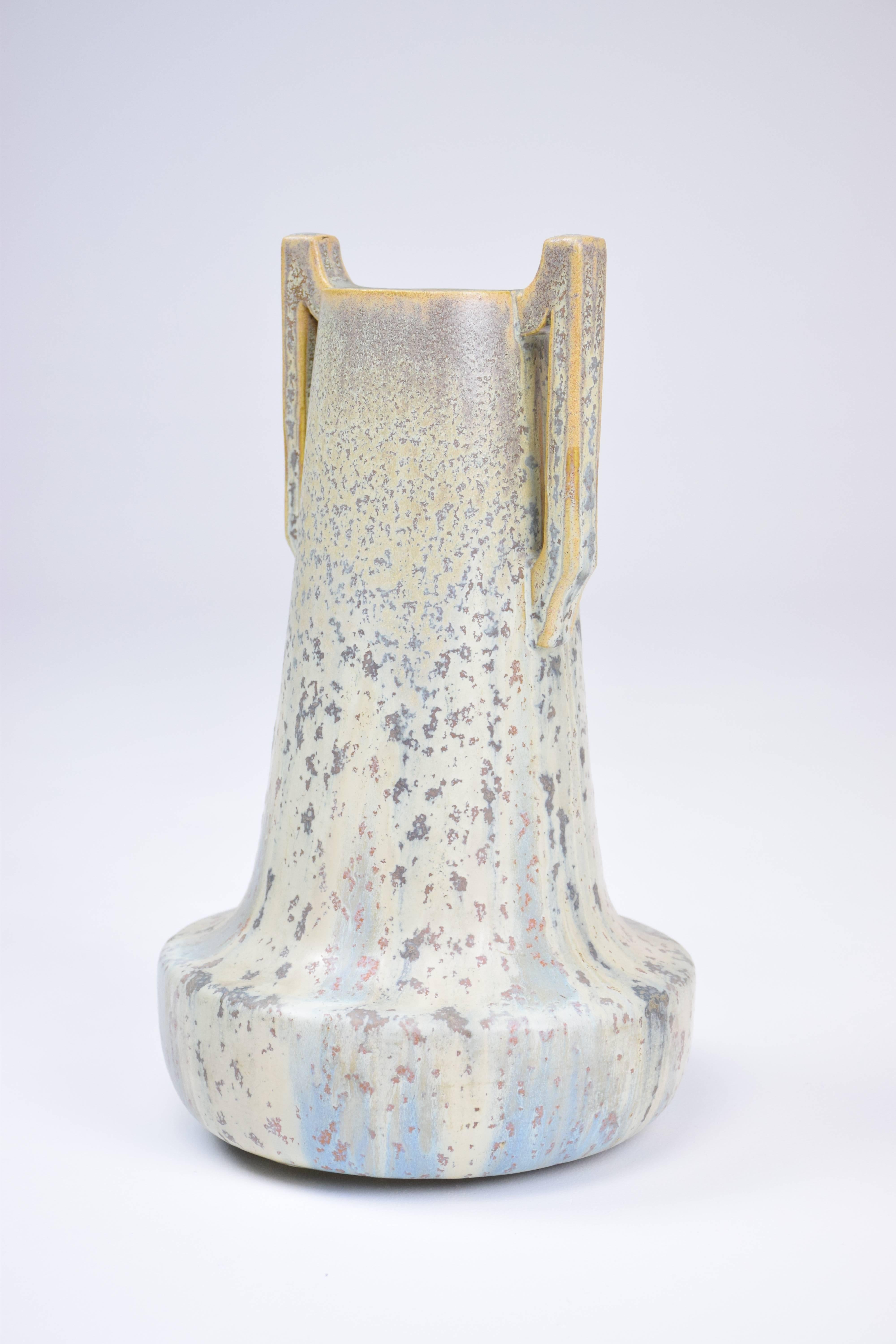 Sandstone vase with handles by French Art Nouveau ceramist Jean Langlade, France circa 1879-1928. Beautiful hues of light blue, red, white, yellow green. 

Signed by maker at the bottom. 

