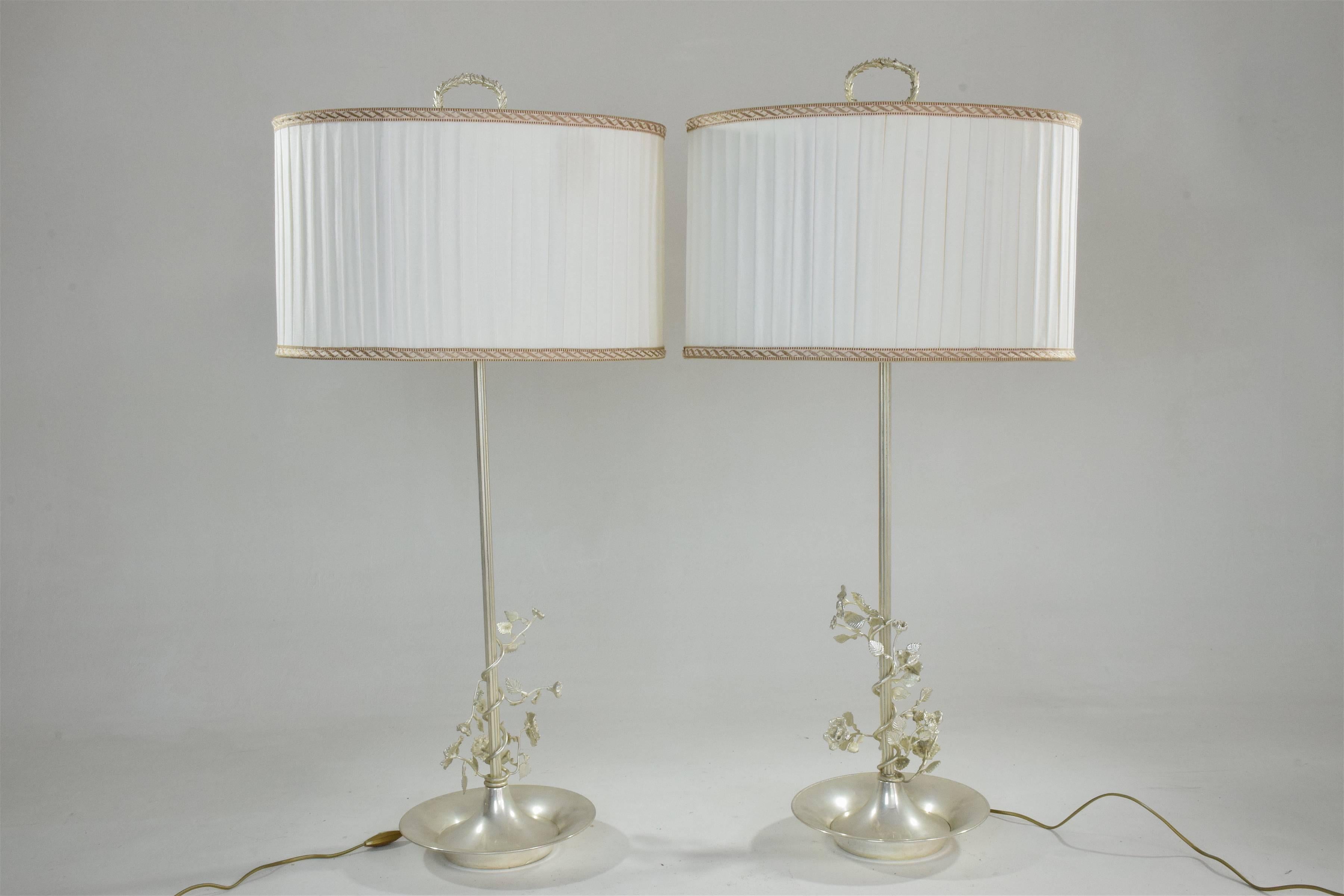20th Century vintage pair of silver plated, 1960s table lamps with flower designs of exceptional craftsmanship. Marked by Spanish silverware makers Valmazan. 
The shades are in an excellent original condition and have been carefully cleaned, we have