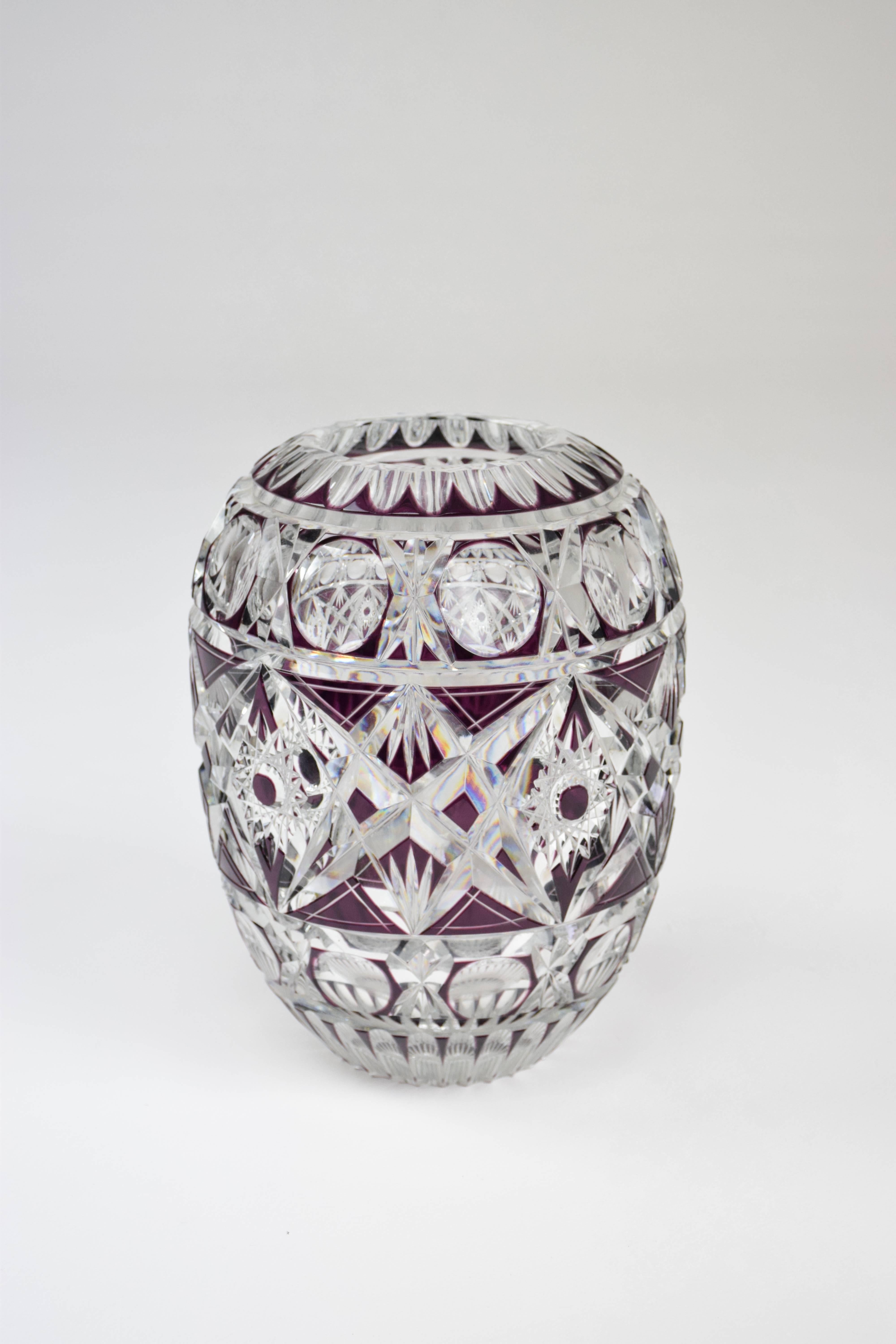 A crystal overlay cut vase of excellent craftsmanship in the style of Val Saint Lambert with no chips coloured in a vibrant purple. 

France, circa 1960-1970s.