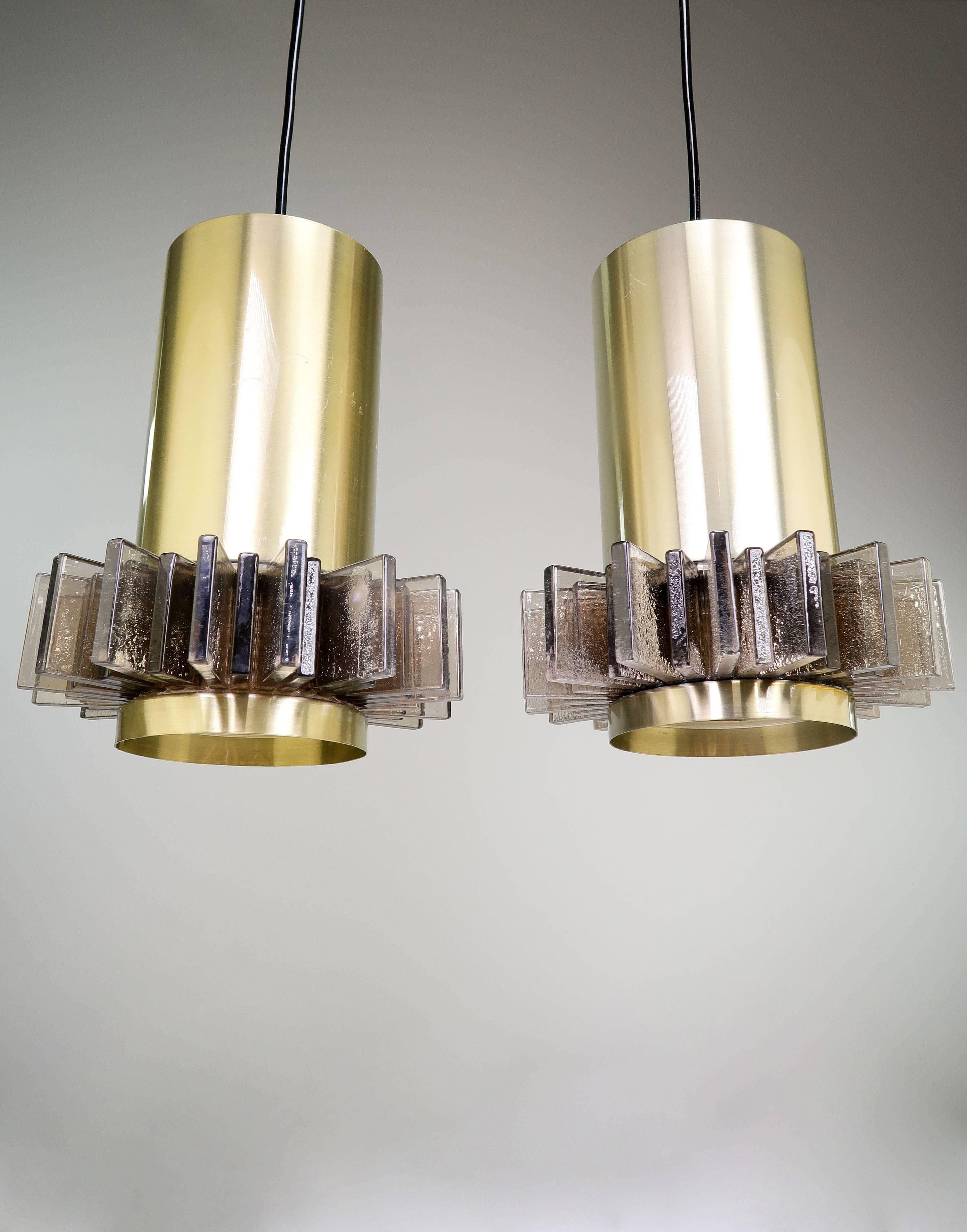 Pair of Danish Mid Century Modern Space Age pendants by designer Claus Bolby for CeBo Industri in the mid 1970s. Brass body with brownish black textured acrylic slates. Bolby had a signature technique that involved adding bubbles to the acrylic for