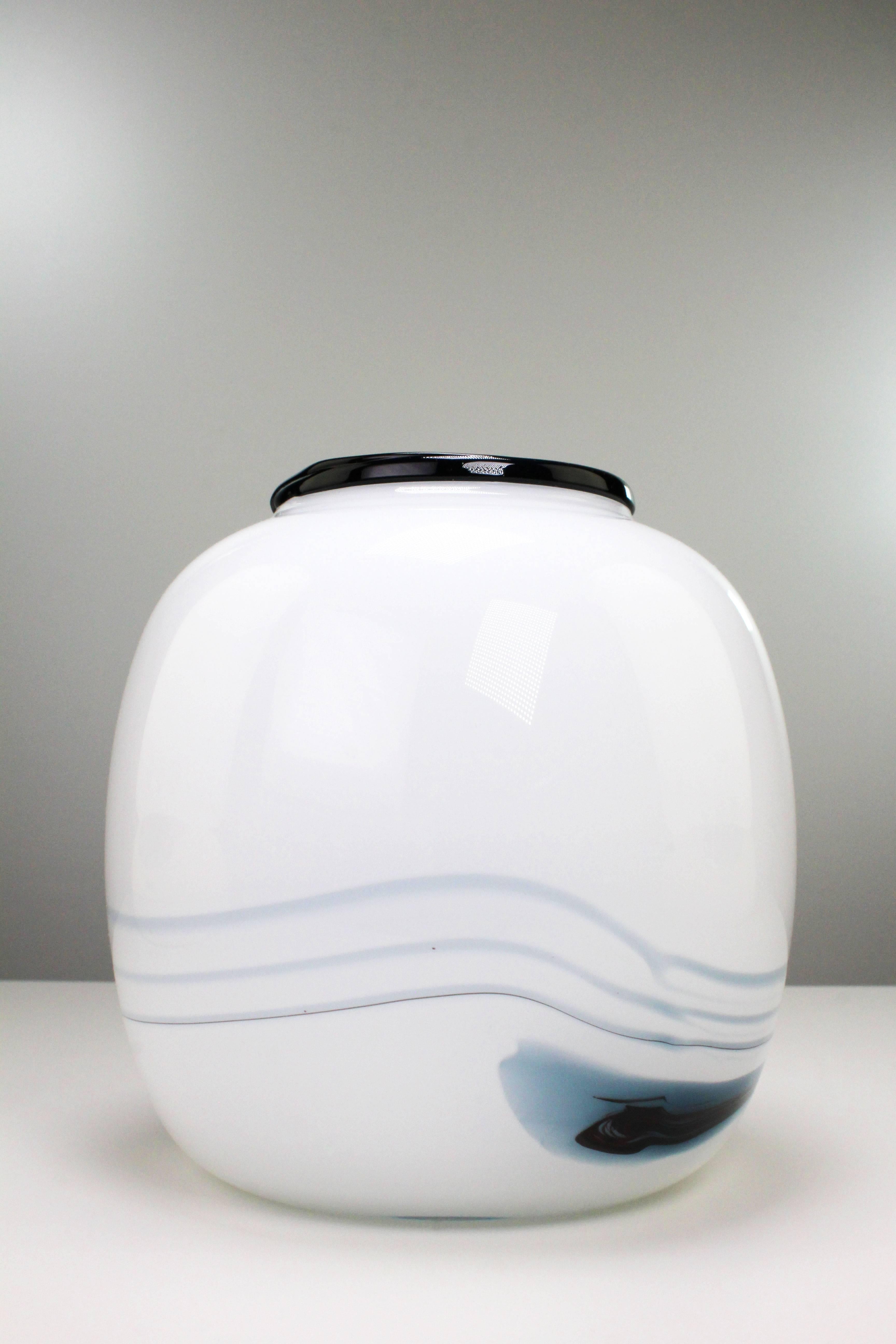 Danish modern smooth round vase with smoky blue and black pattern in milky white glass. From the series Atlantis by art glass designer Michael Bang for Danish Holmegaard. Beautiful, unused condition. Manufactured in the town of Næstved on Southern