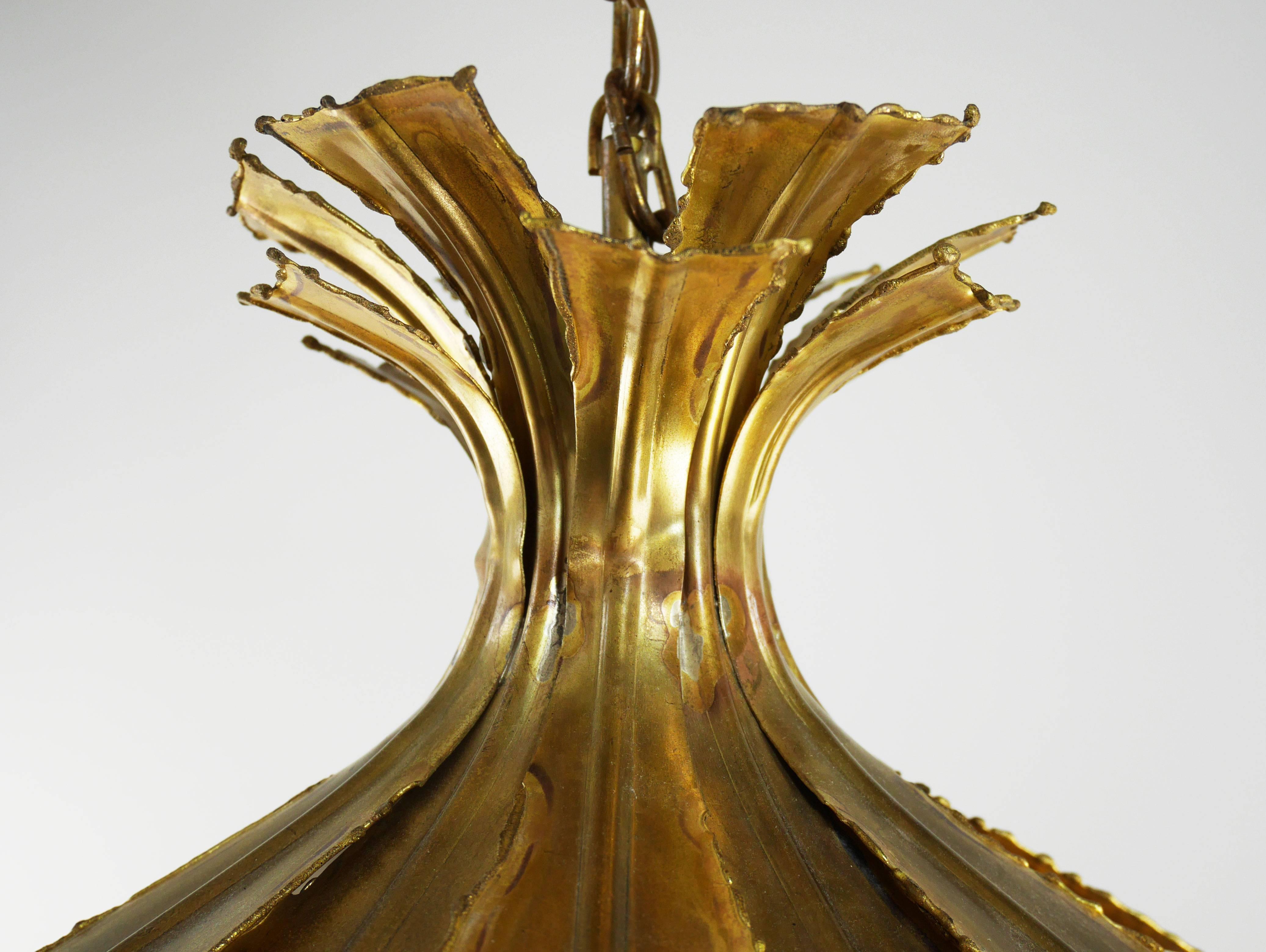 Large standout piece by the versatile Danish designer Svend Aage Holm Sorensen. Danish Modern Brutalist patinated brass pendant named The Onion. The brass petals are torch cut and acid treated for effect - Holm Sorensen's signature method. The piece