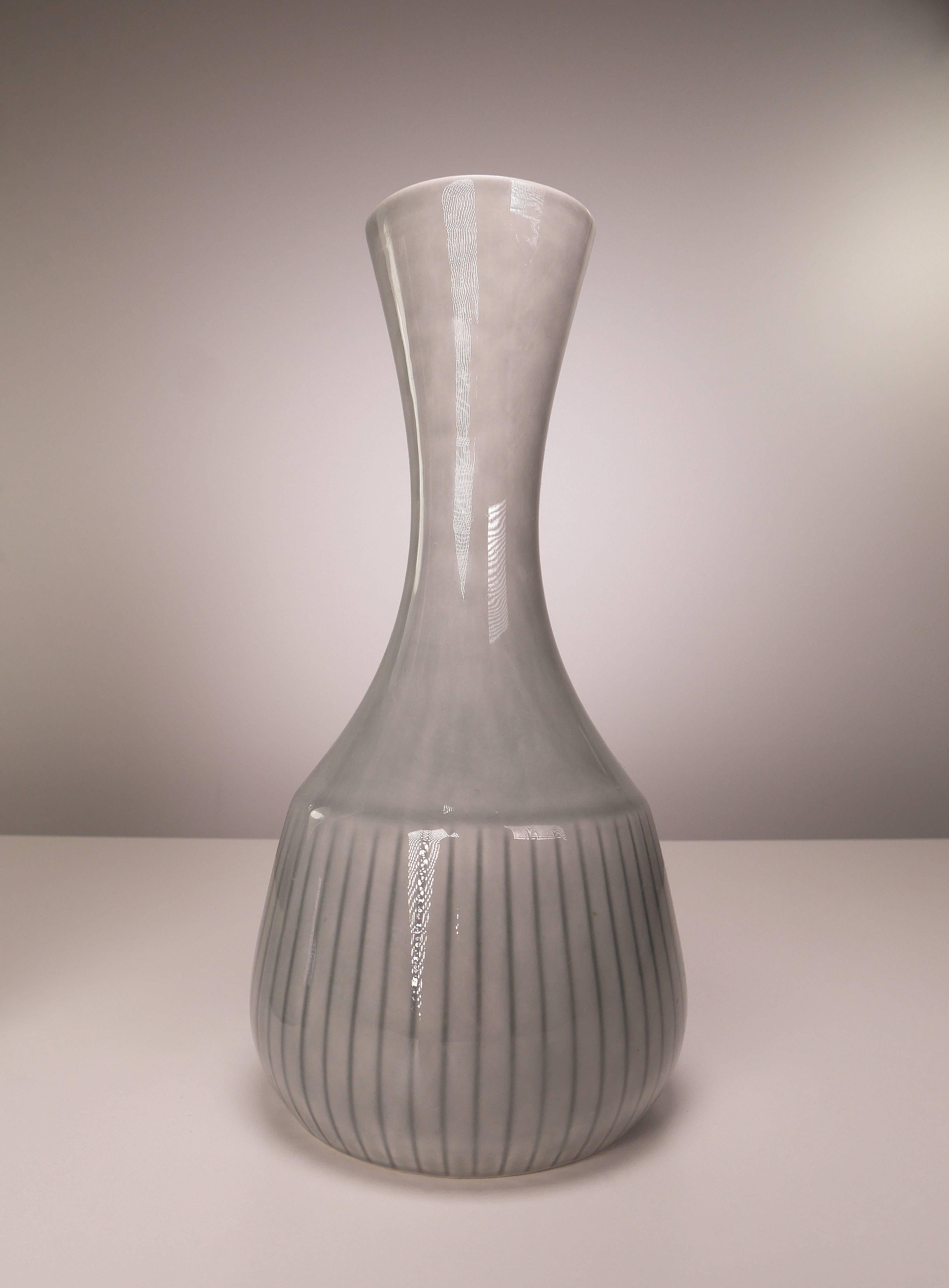 Rare set of two Scandinavian modern smooth porcelain vases by acclaimed designer Gunnar Nylund for Rörstrand and Nordiska Kompaniet in Sweden. Light gray glaze with dark gray stripes on the belly. Stamped Rörstrand Sweden and NK (Nordiska Kompaniet)