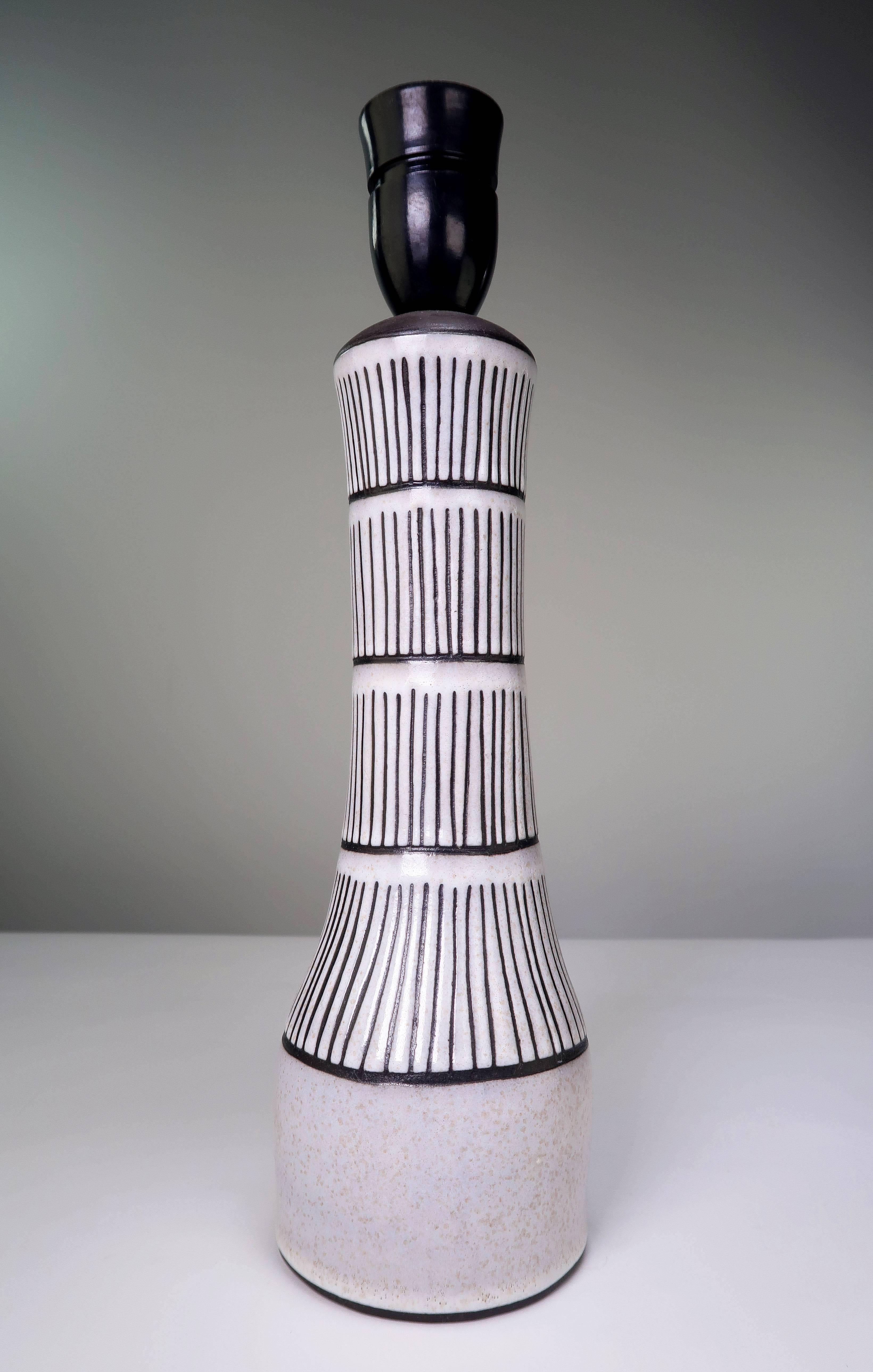 Handmade and hand decorated Mid-Century Modern chalk white and anthracite striped ceramics table lamp by German designer Marianne Starck for Danish Michael Andersen & Son. From the 