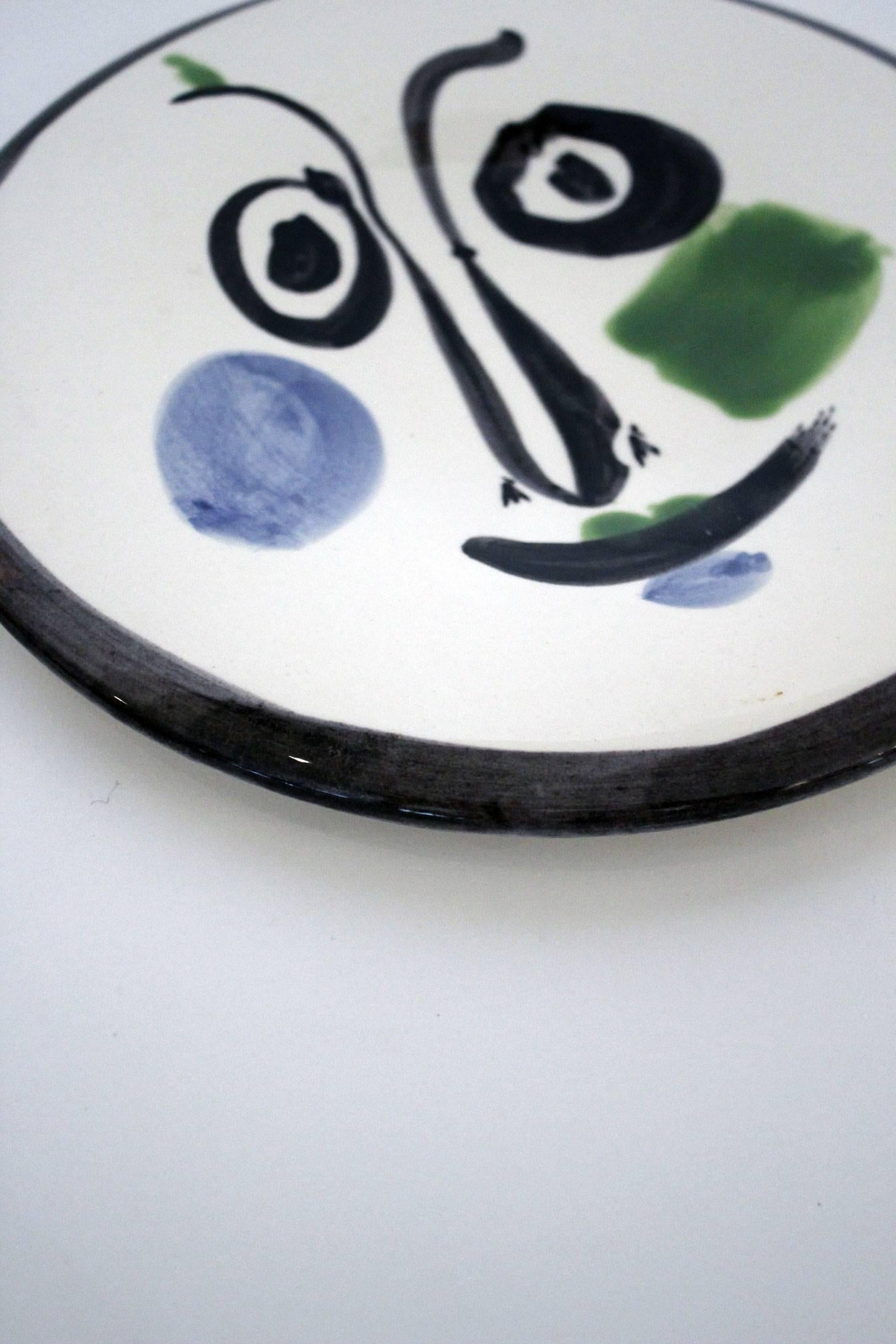 Pablo Picasso Madoura plate executed in ceramic. White earthenware clay, engobe and enamel decoration. Information detailed on the back: 'Visage no.197'. Numbered 347 in an edition of 500.