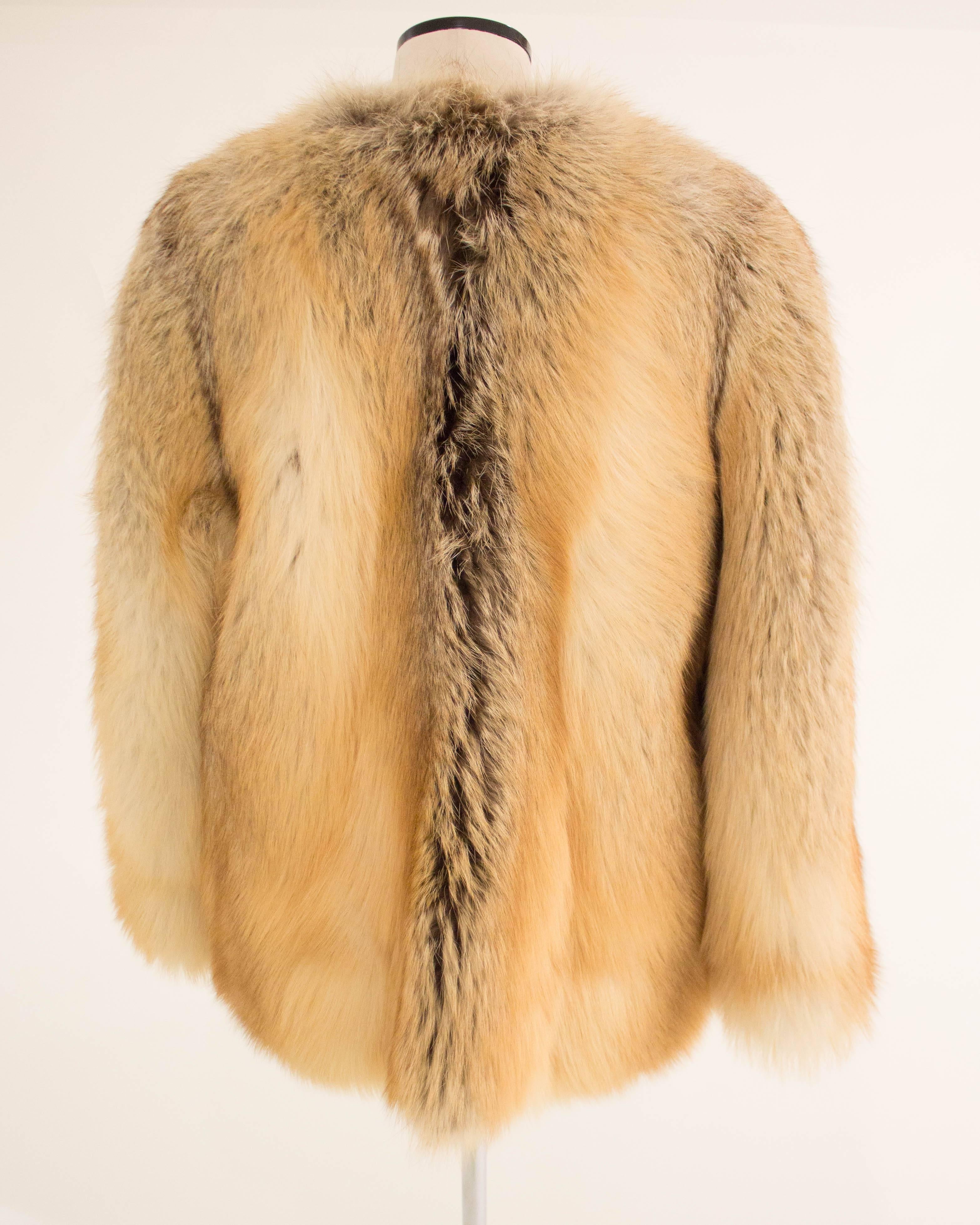 This fox fur coat is a rare runway sample from Alexander McQueen's short tenure at the storied fashion house, Givenchy. Entirely assembled and lined by hand in Paris, this fur coat is a striking example of McQueen's brilliance and an important