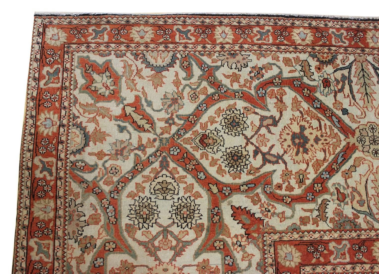 Modern Turkish production of a Motasham Kashan style carpet. Extremely Fine and in perfect condition. All-natural vegetable dyes. Salmon and ivory on light blues. Wool pile on a cotton foundation.