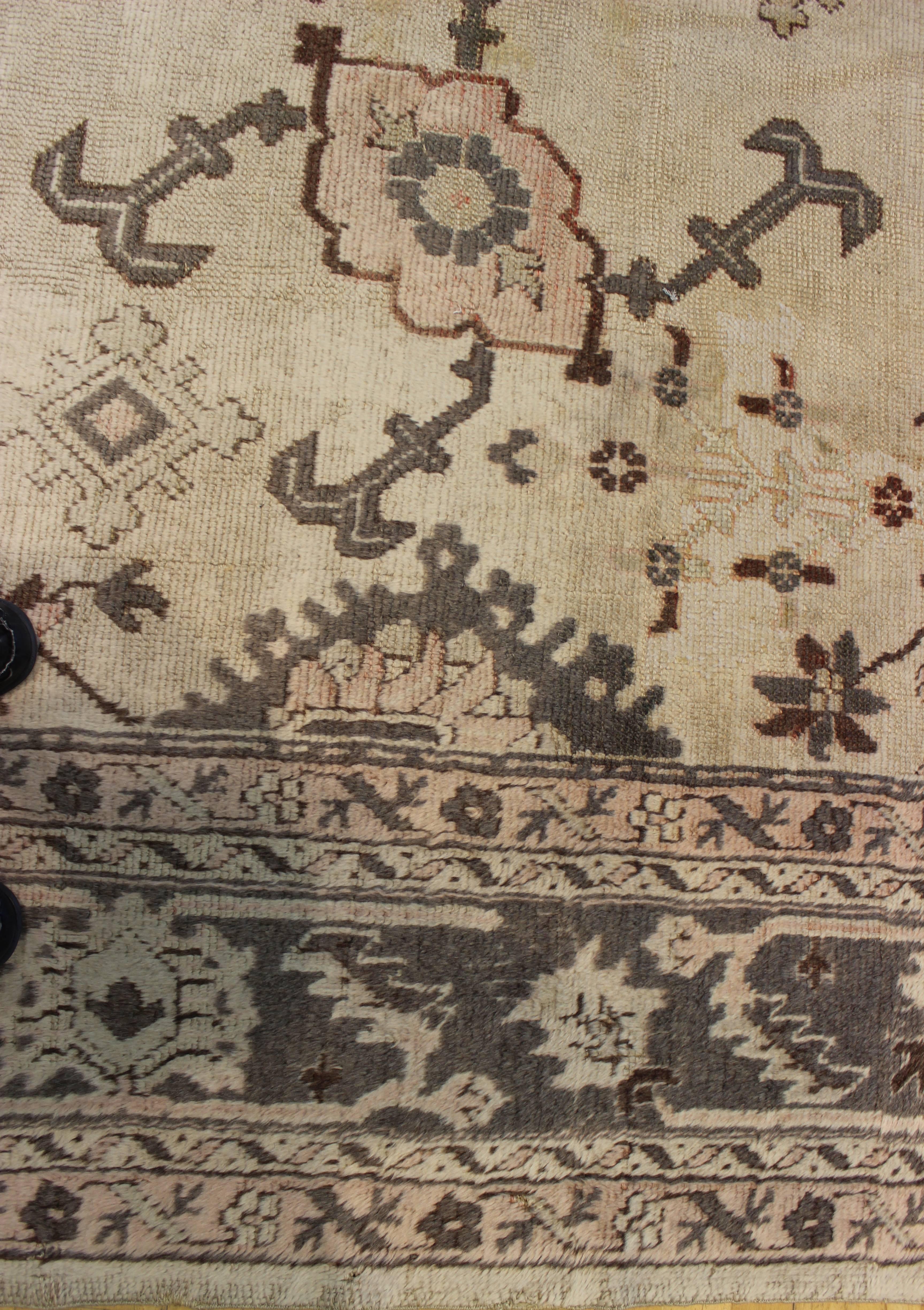 Harshang pattern Oushak carpet, circa 1910. This rug was previously antique washed, giving it a more subtle coloration.