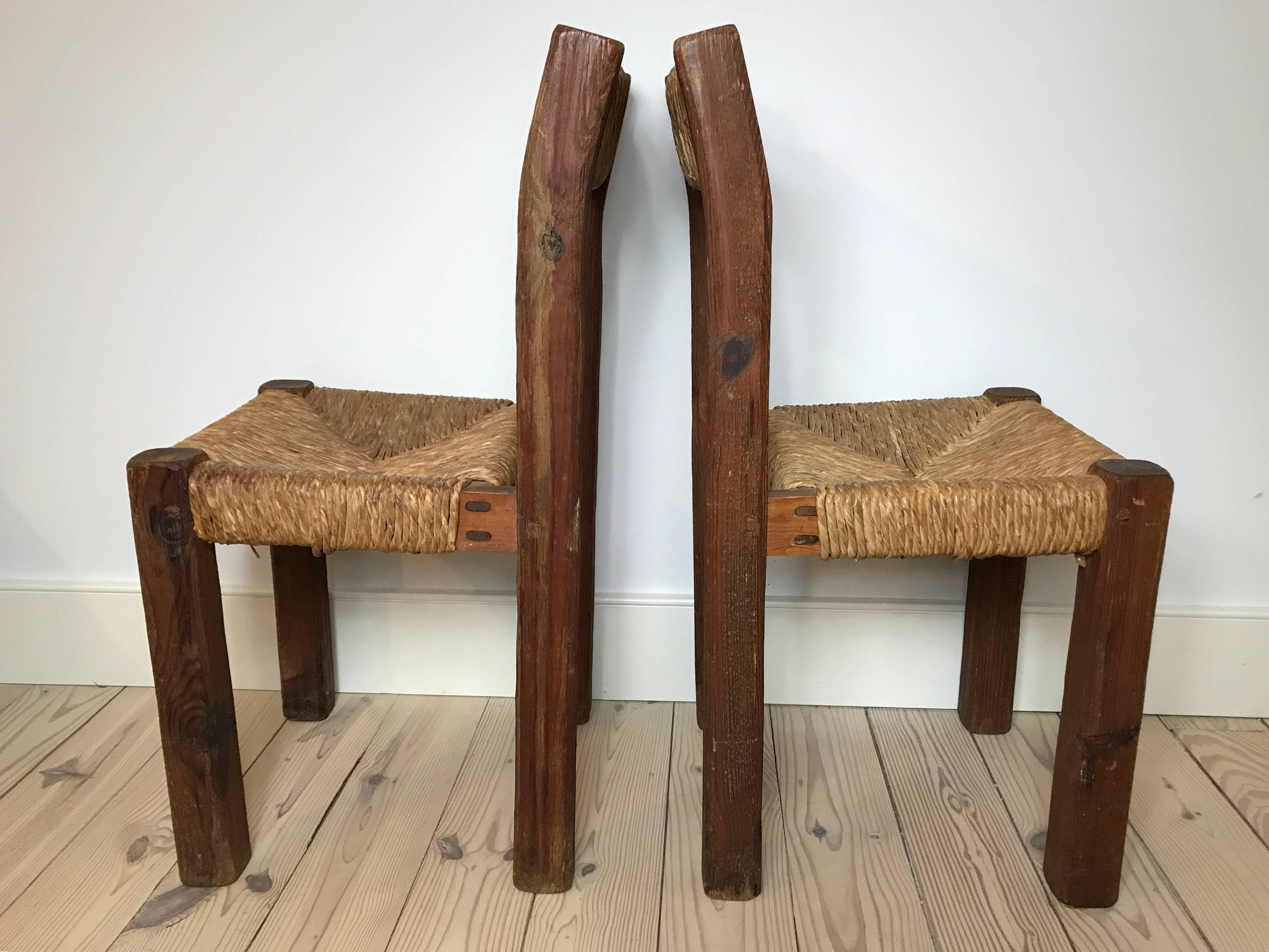 A pair of 19th century French side chairs with rope seats and back. Solid and sturdy construction.