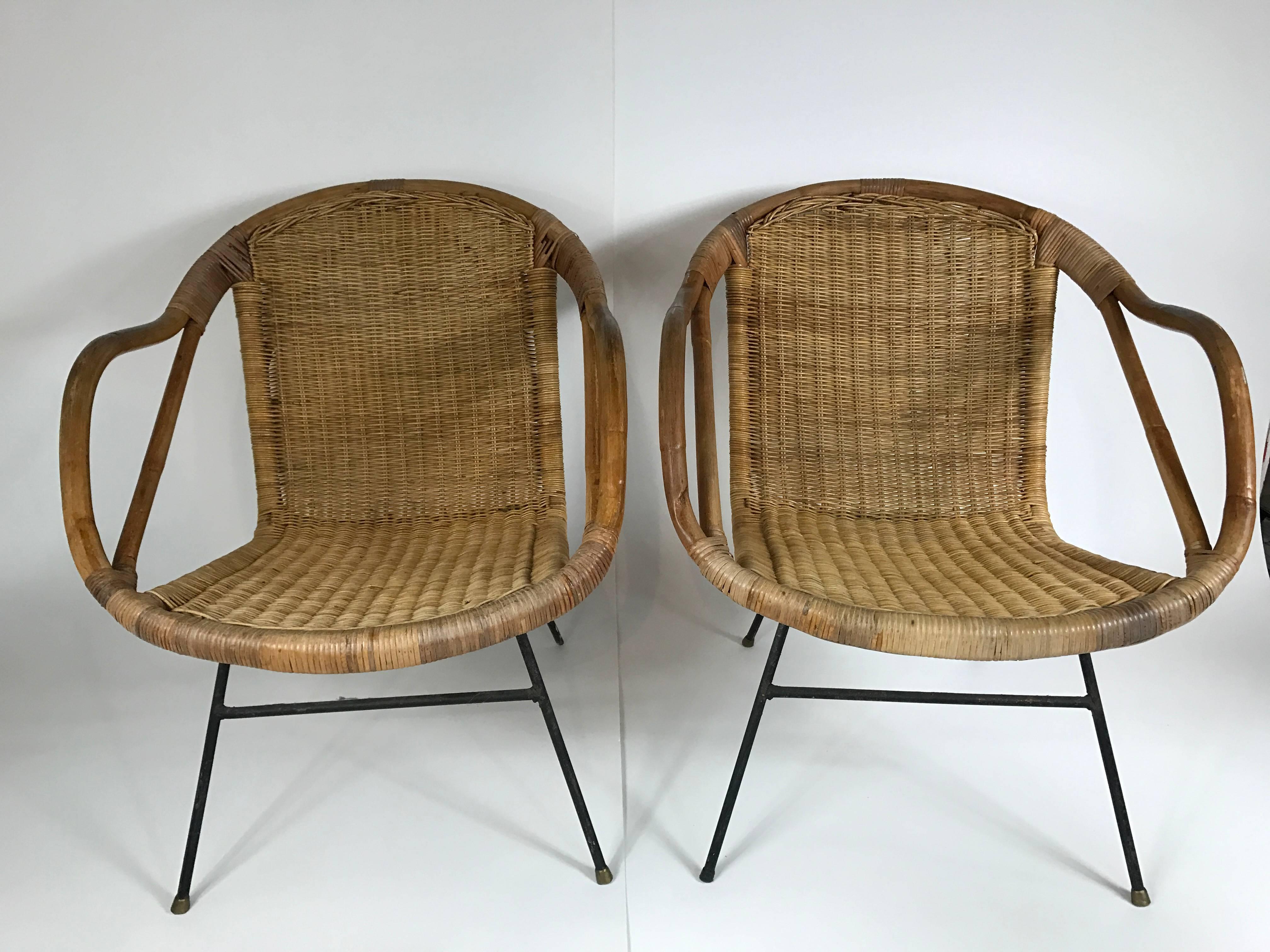 Great pair of rattan and wrought iron armchairs in the manner of Arthur Umanoff.