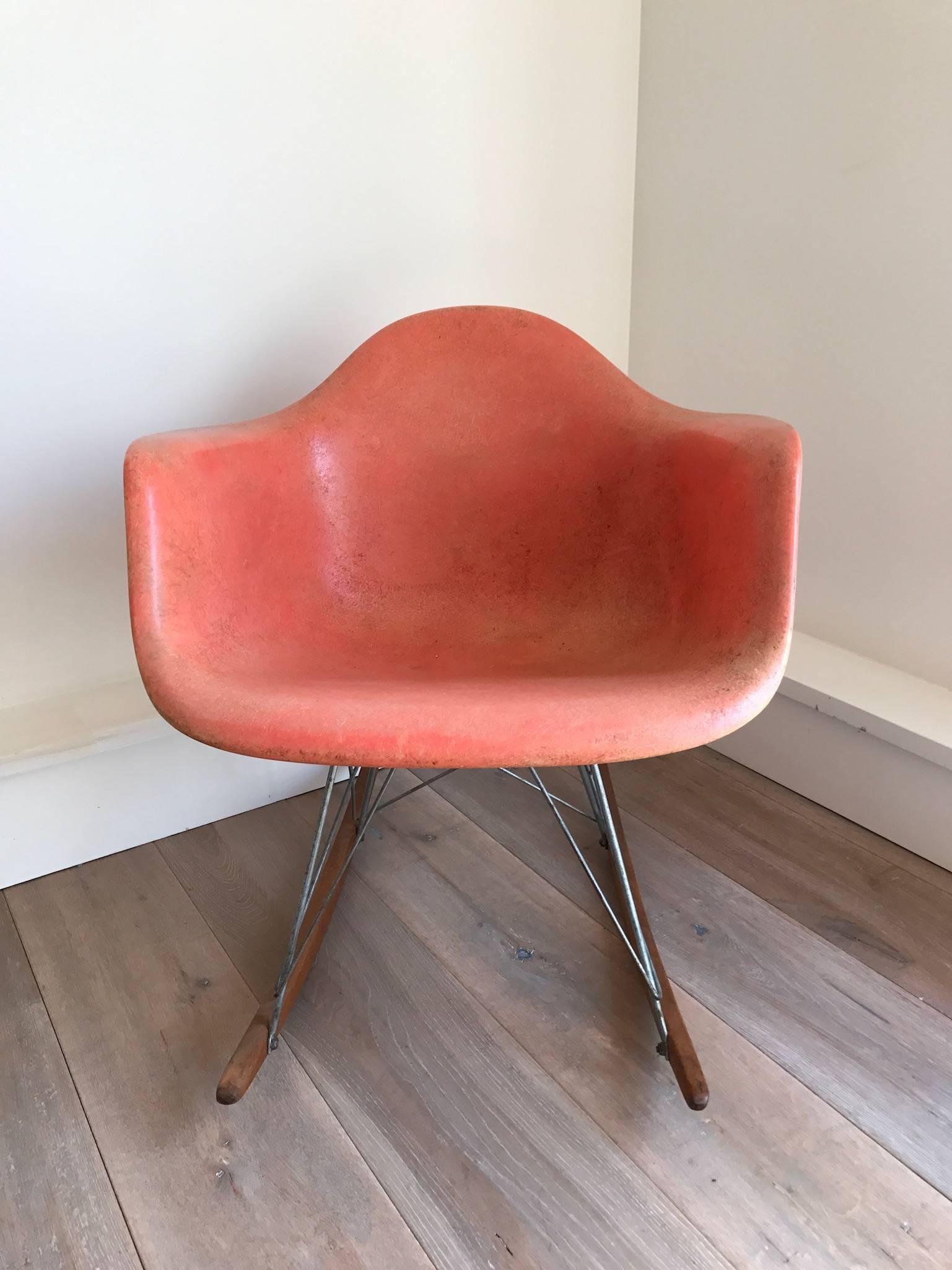 Early Eames for Herman Miller rocker with a rare coral colored fiberglass seat. Excellent vintage condition. 
