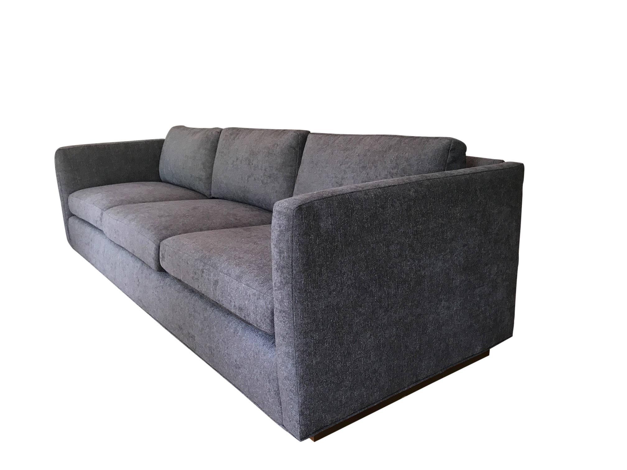 Stunning three-seat tuxedo Sofa designed by Milo Baughman for Thayer Coggin. Wood plinth base is raised on casters for a 