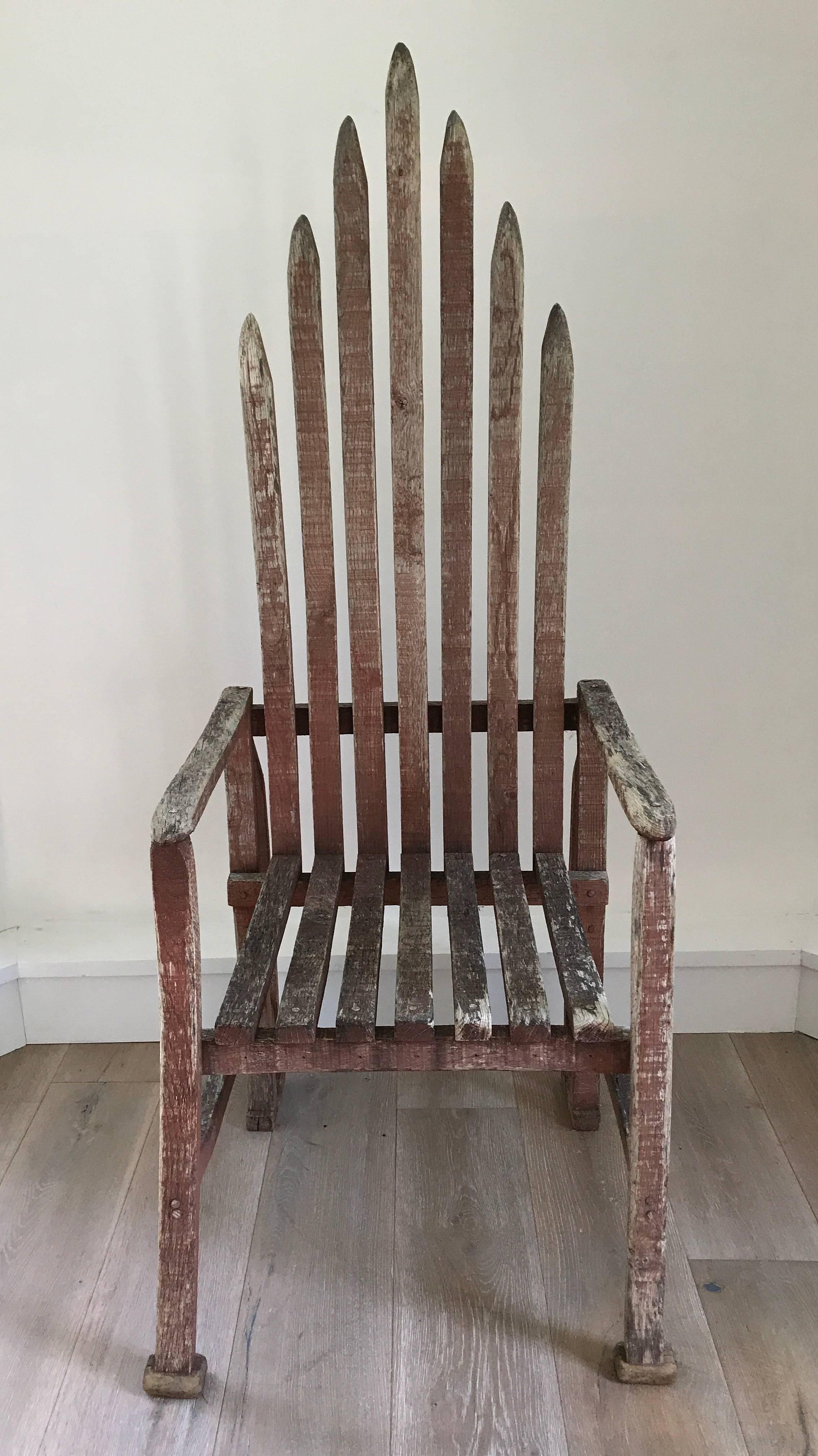 Very unique early 20th century American folk art chair made of reclaimed material. Fabulous patina to weathered frame.
