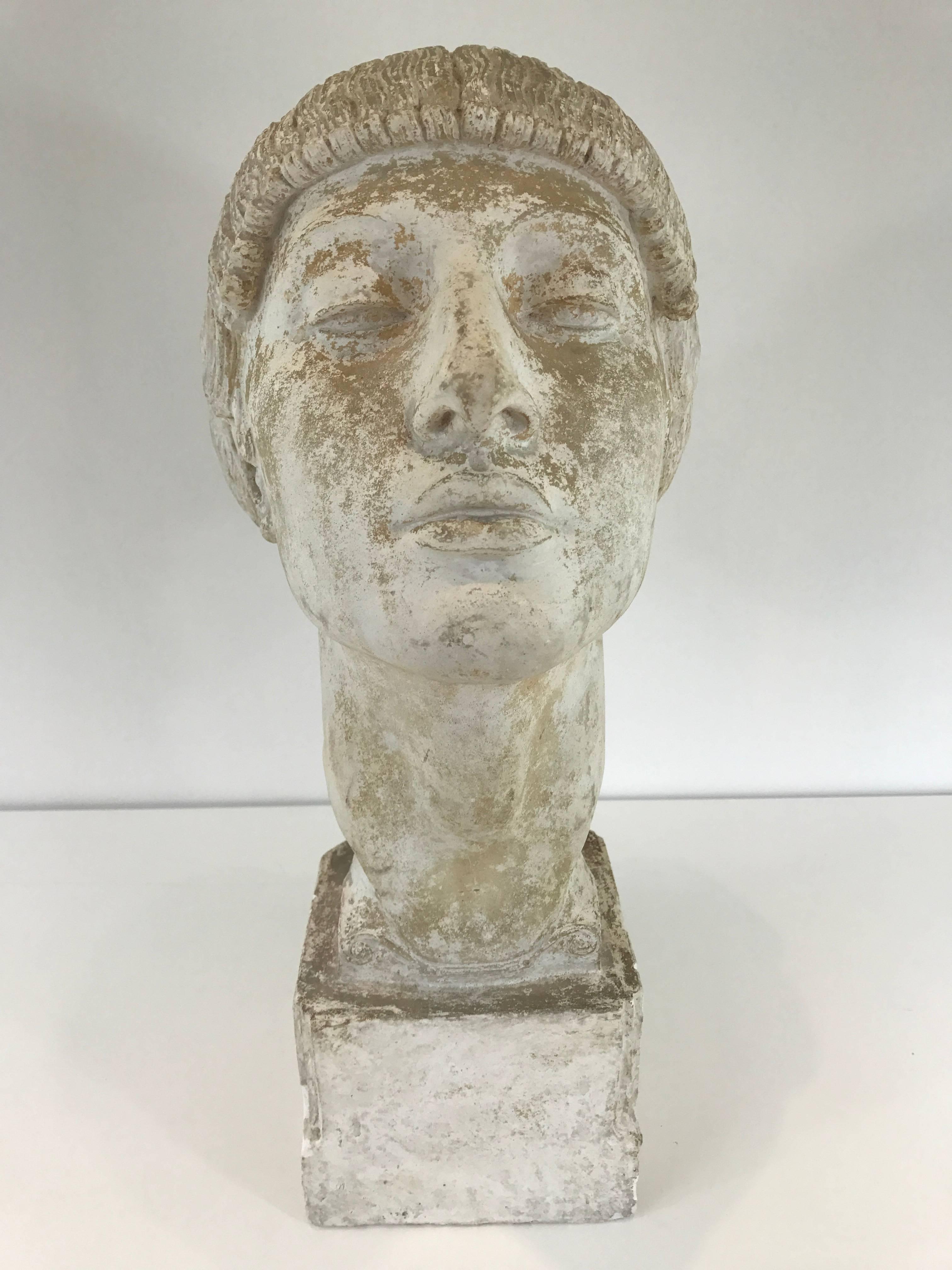 Art Deco plaster portrait bust of a woman. Strong expression with braided hair.