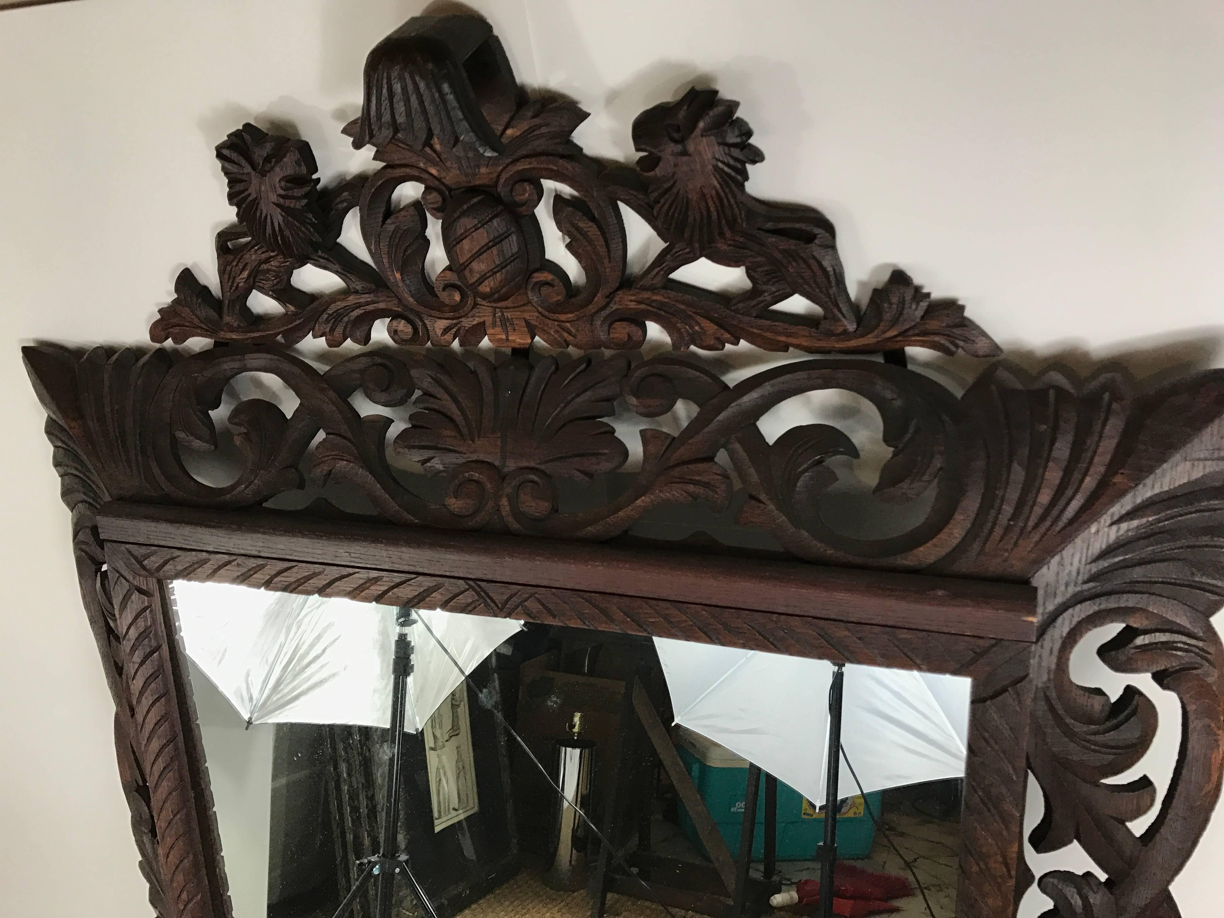 Stunning and large 19th century French heavily carved wood mirror. Recently refinished wood frame and new mirror. Measure: The 9