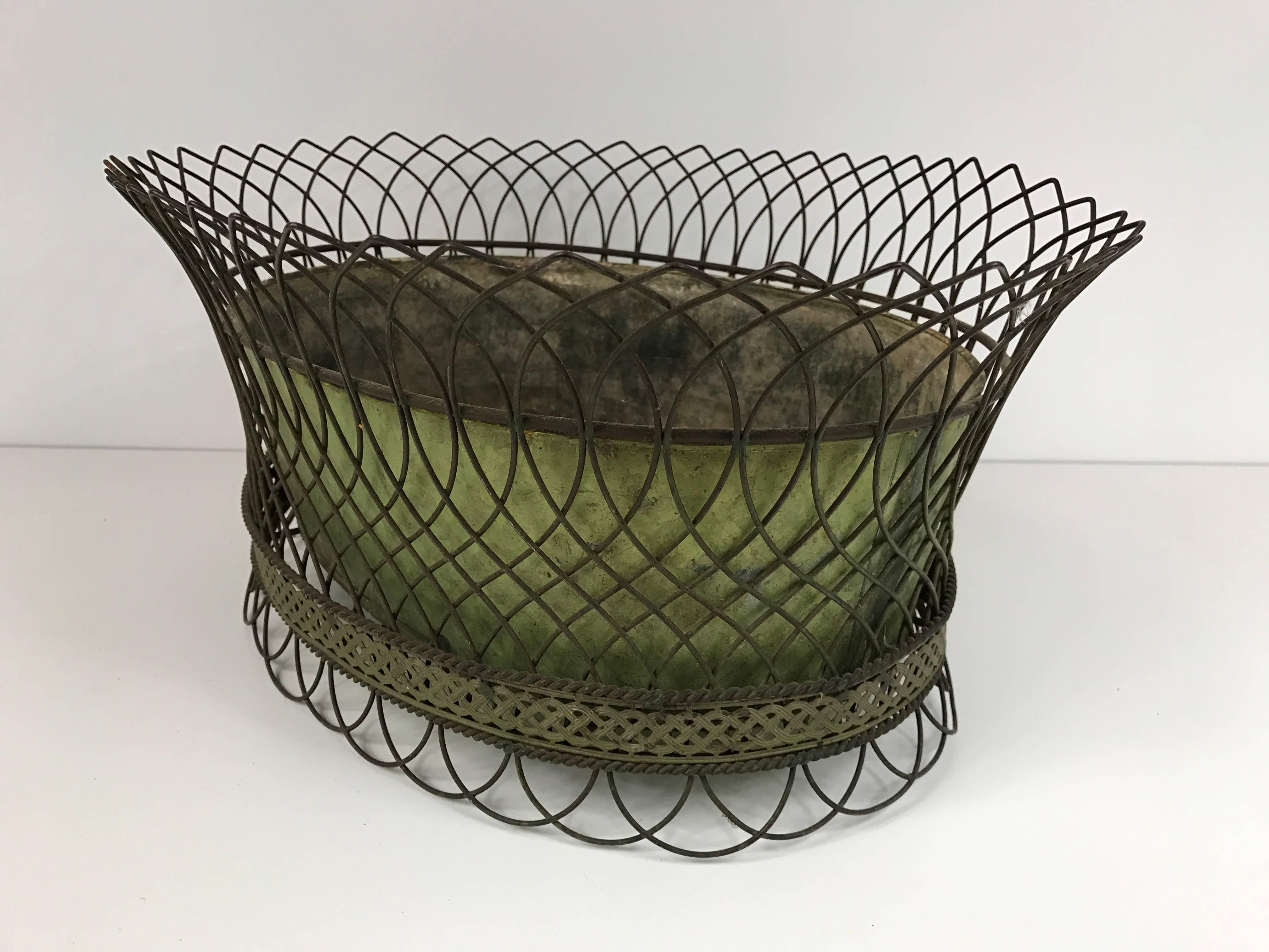 Single antique French wirework planter with removable tole liner. Discounted for a limited time.