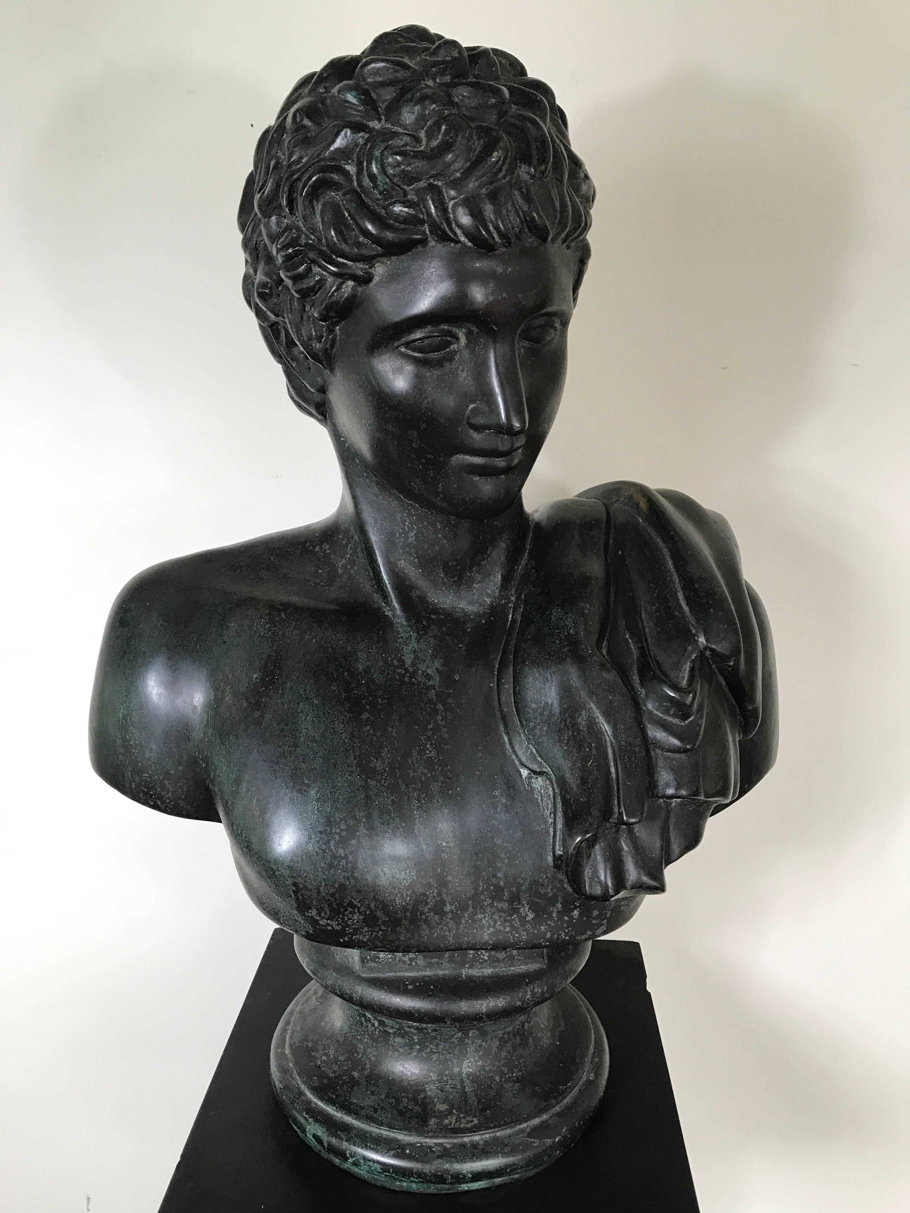 Striking Grand Tour bronze bust of Hermes on associated black marble pedestal. Excellent patina to bust and minor wear to pedestal consistent with age.