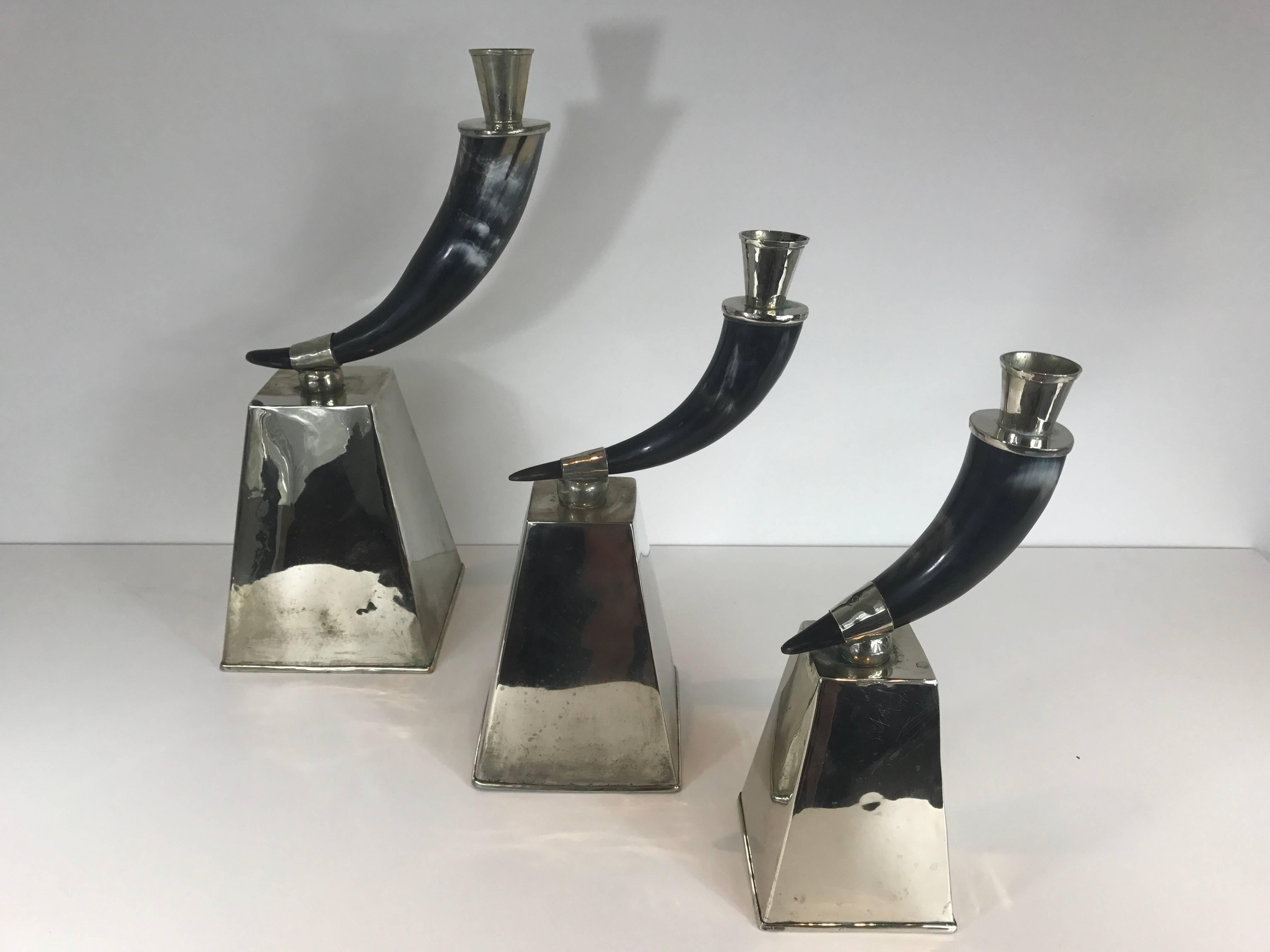 Argentine Three Graduated Horn and Silvered Metal Candlesticks