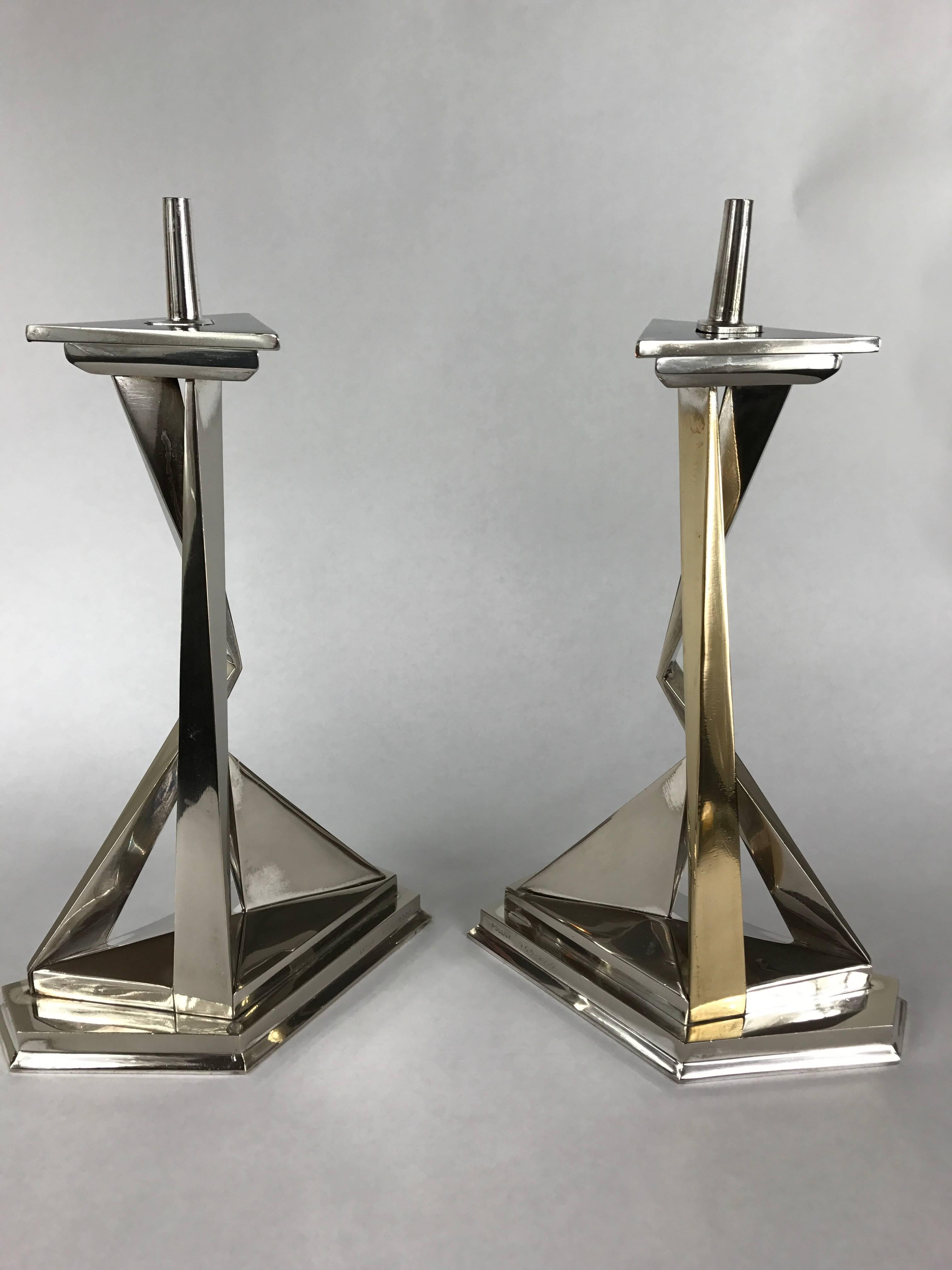 A pair of sculptural candlesticks by Salvador Dali. caster & Pollux, edition 968/2000. Includes two flat top fitters. Nickel and brass plated bronze.