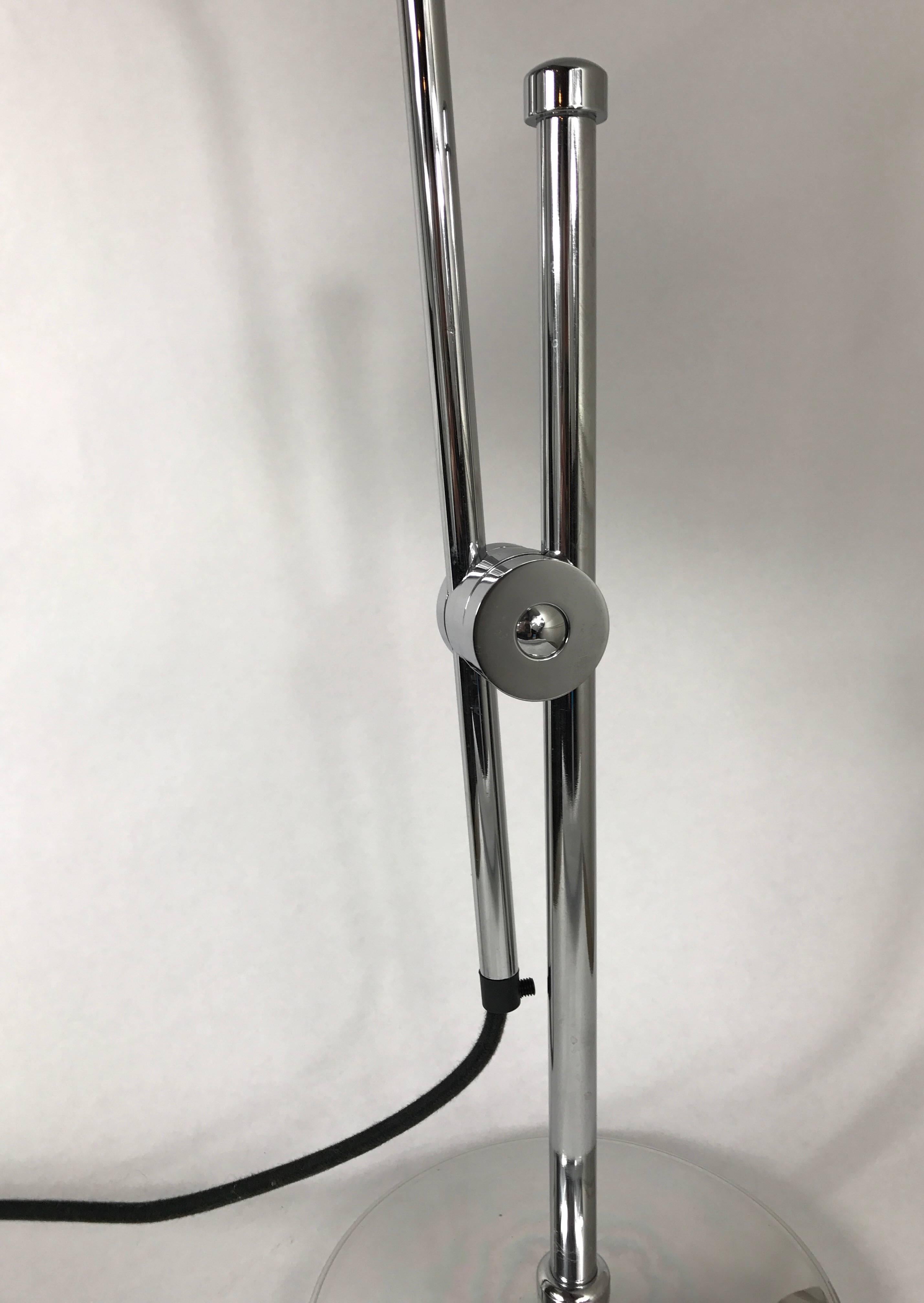 A BTC England task lamp in polished aluminium. Adjustable swing arm and shade.