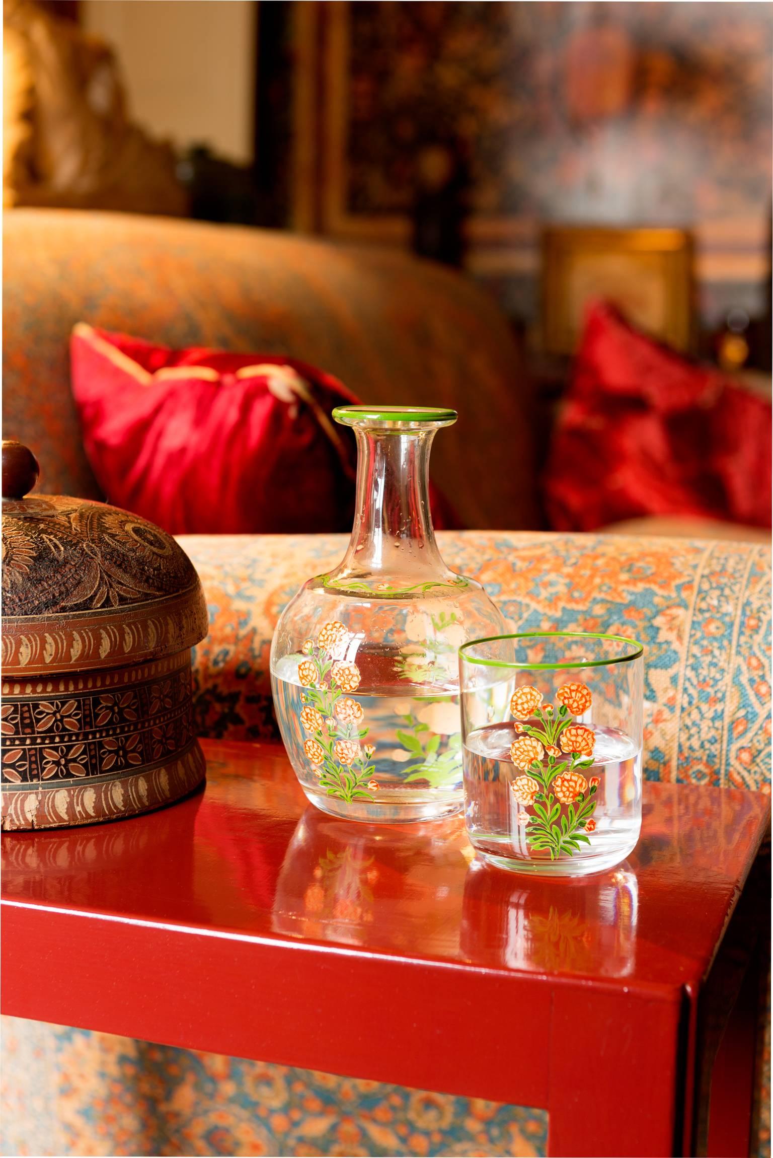 Murano bedside night carafe set with tumbler. 

A special set of bedside carafe and drinking cup. 
Handcrafted and hand-painted by Venetian artisans respecting the most traditional glassmith techniques and decorated with floral motifs.

 