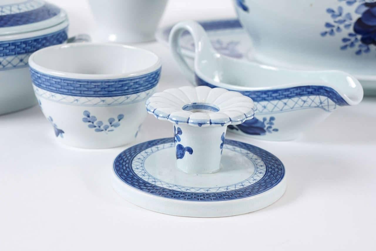 Approximately 75 pieces of hand-painted and signed Royal Copenhagen dinnerware, in the very popular Tranquebar pattern. Offering includes covered soup tureen, covered and open vegetable servers, platter, cruet set, candlesticks, gravy boat, teapot