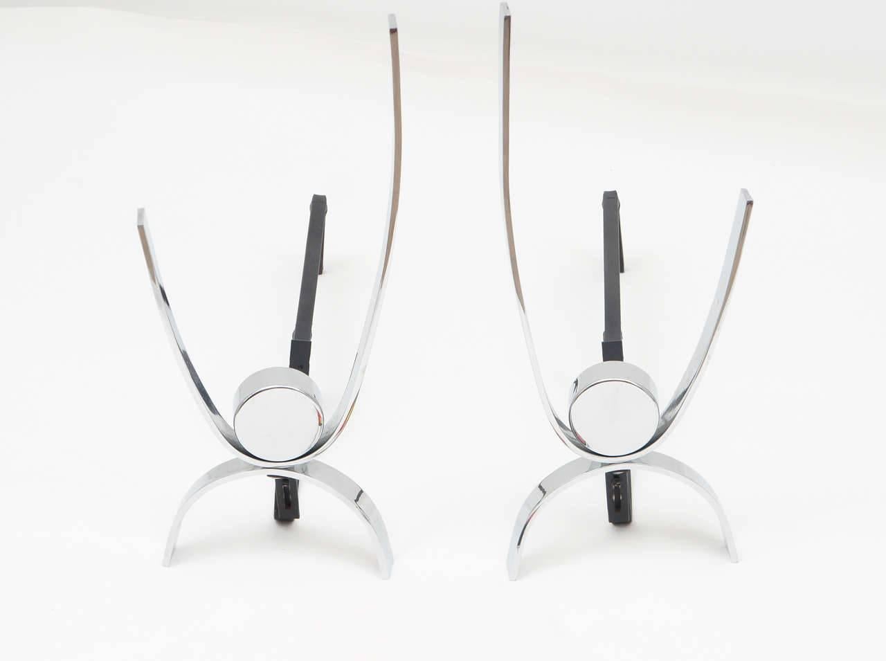 Clean, classic chrome andirons by this renowned Mid-Century designer. Simply elegant!