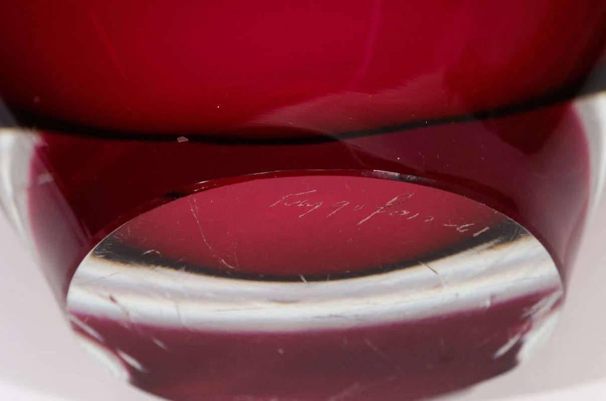 Curvy Swedish cased glass bowl in pink and white, signed on the base. Excellent condition with expected signs of wear to the base.